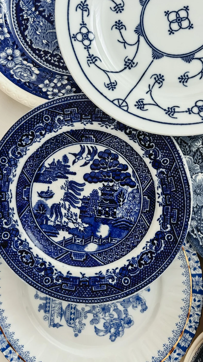 Collection of ornate blue and white porcelain plates featuring intricate designs and patterns.