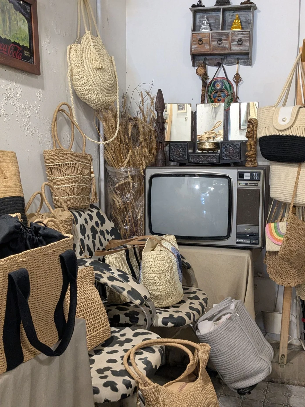A cozy vintage corner featuring wicker baskets and a retro television, evoking a nostalgic feel.