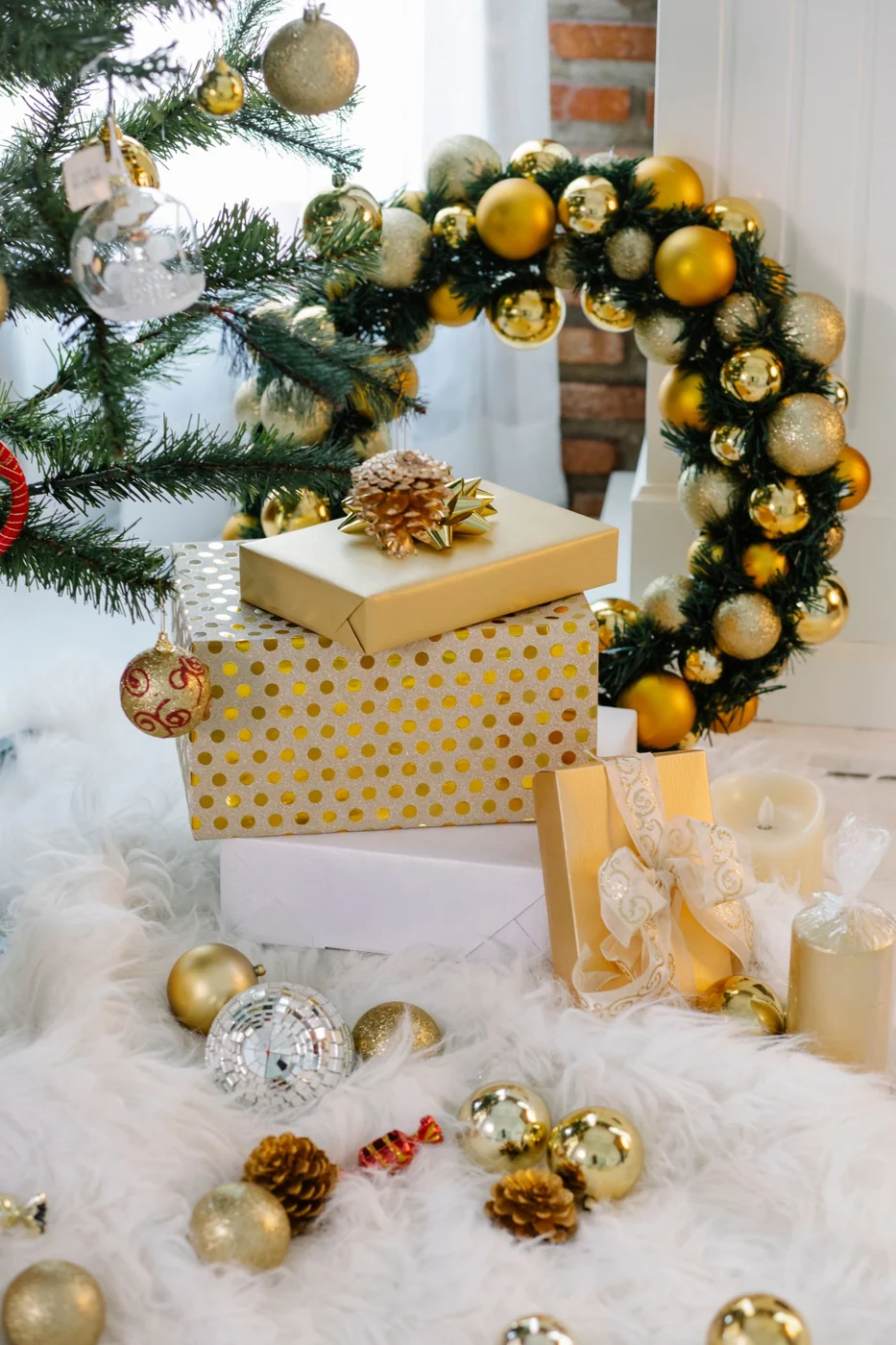Cozy Christmas setting with gifts, wreath, and festive tree.