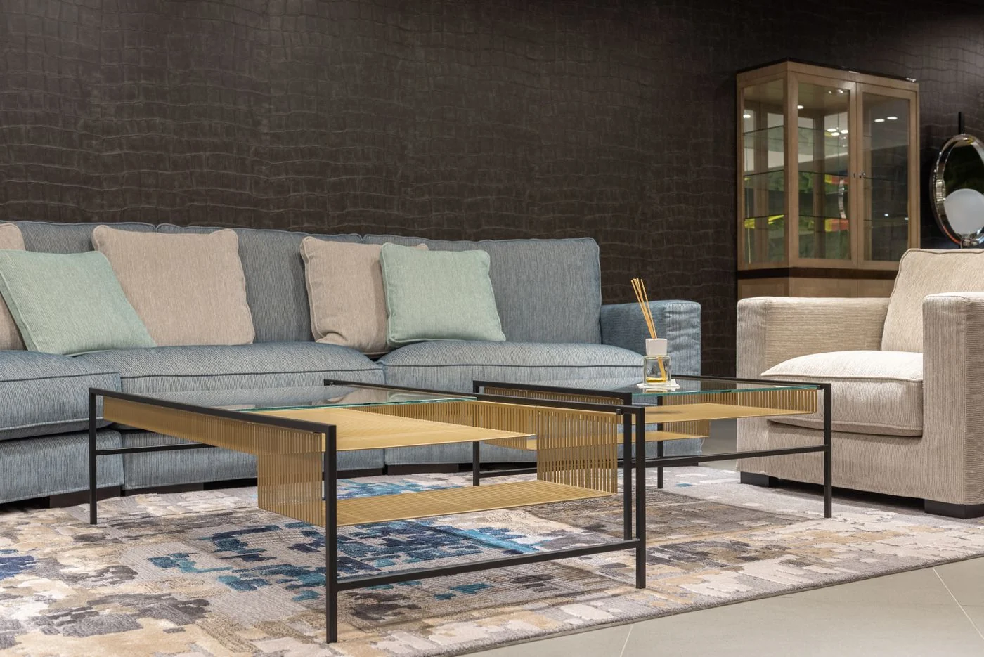 Stylish modern living room featuring a cozy sofa, armchair, and elegant coffee table, perfect for a contemporary home.