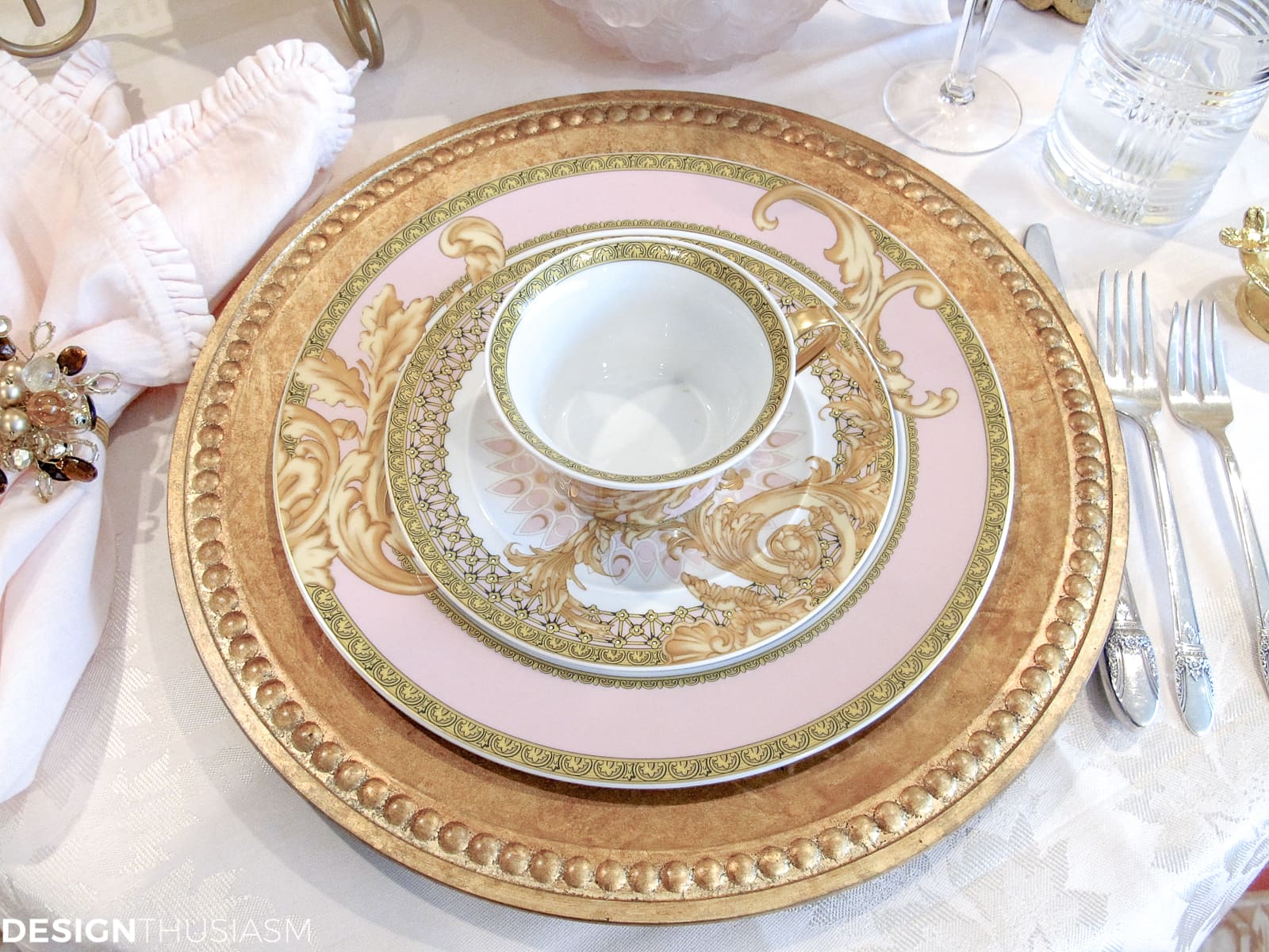 Tea party table setting with pink and gold Versace plates