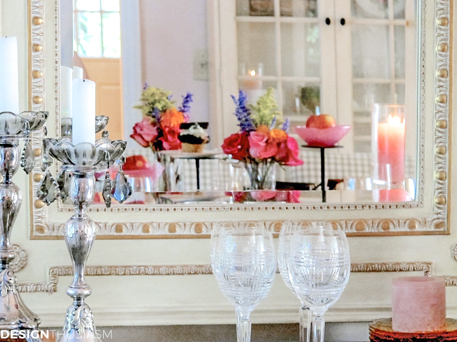 book club table setting with vintage books seen through a mirror