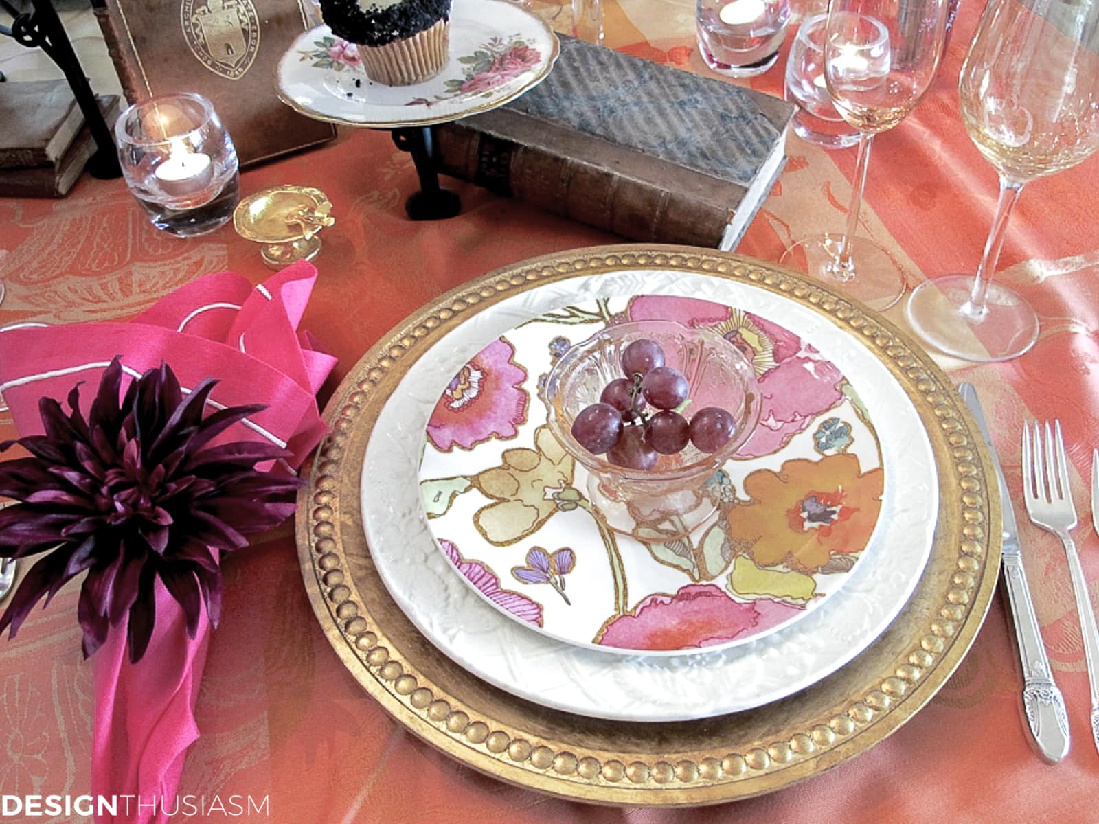 floral plates on a book club table setting with vintage books