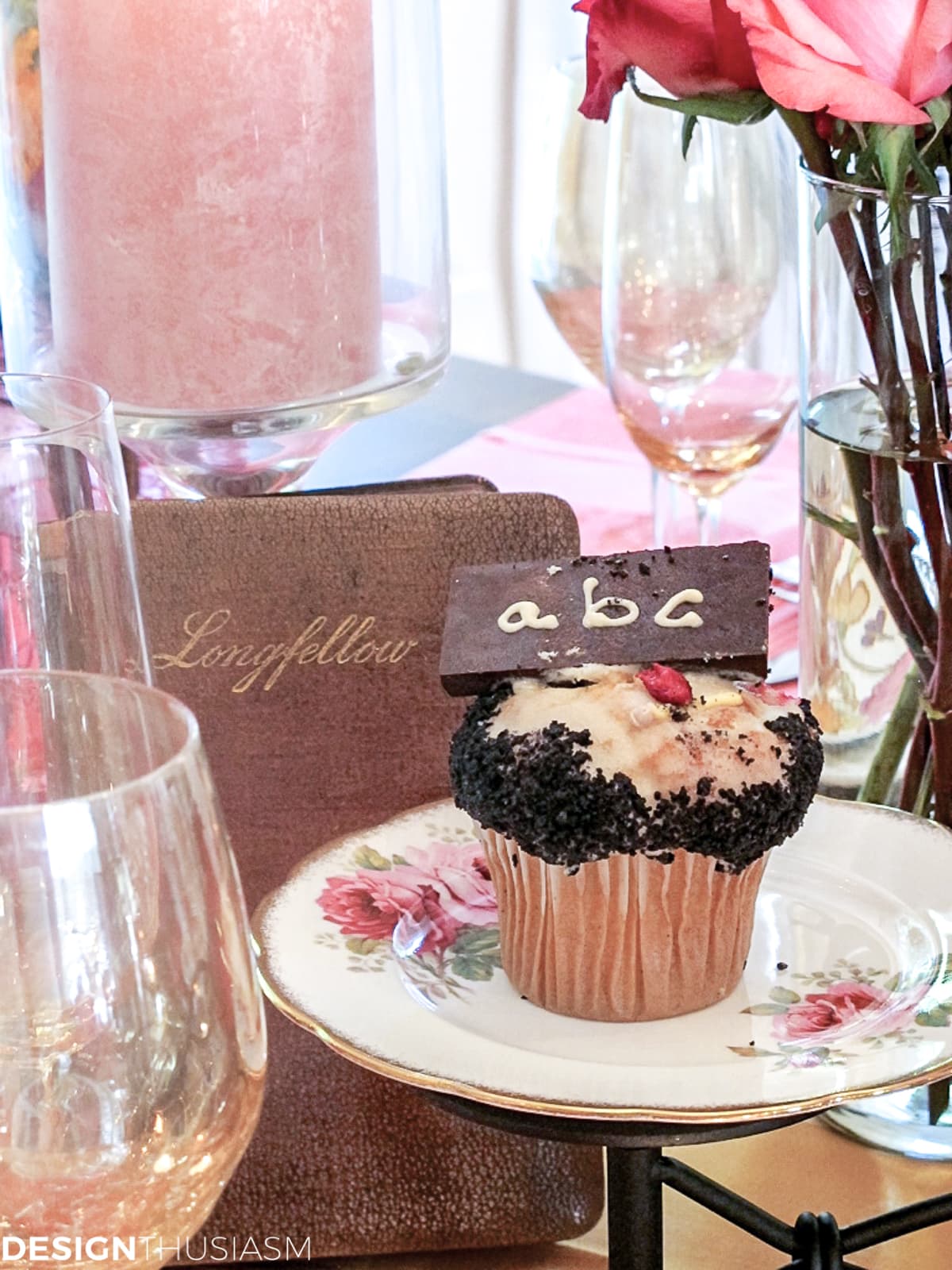 book club table setting with vintage books and alphabet cupcakes