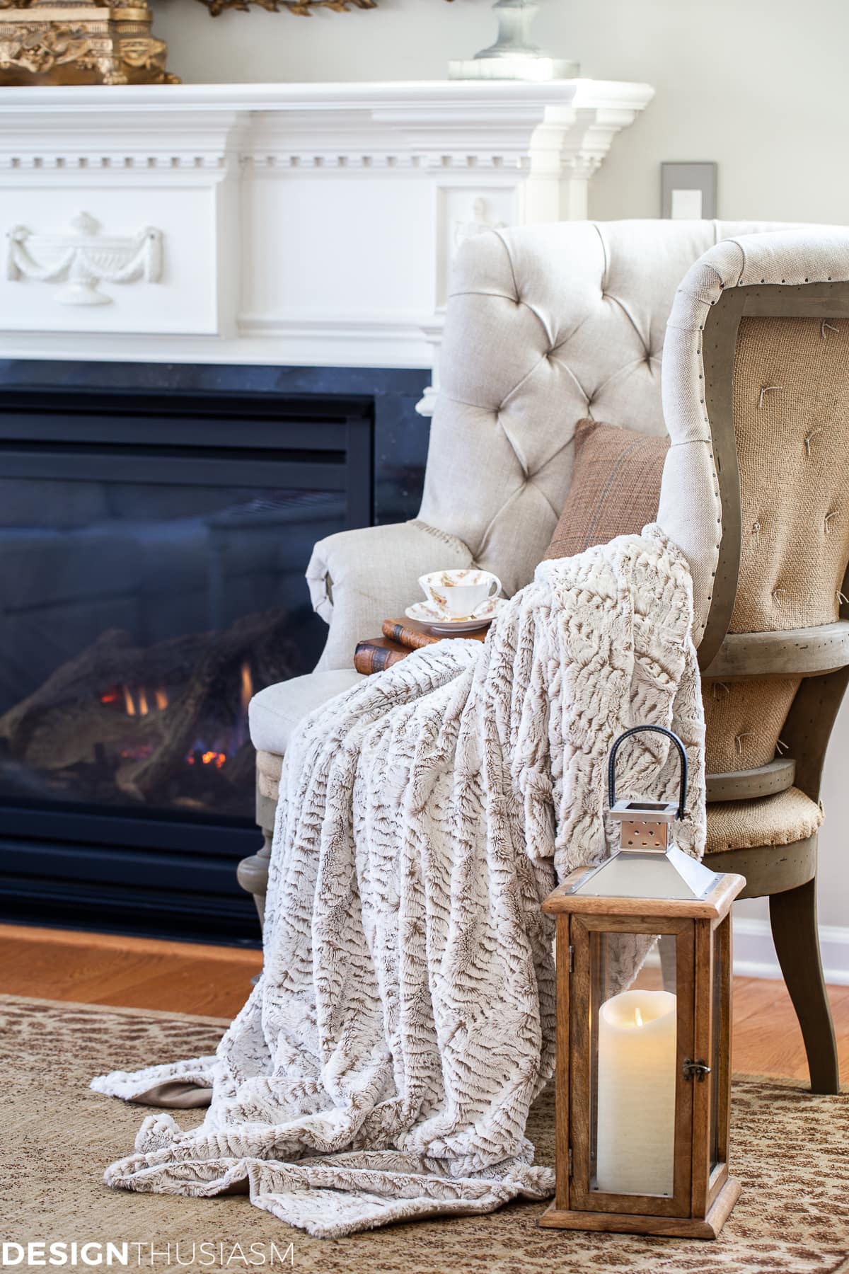faux fur throw blanket with tweed pillow in a cozy winter living room