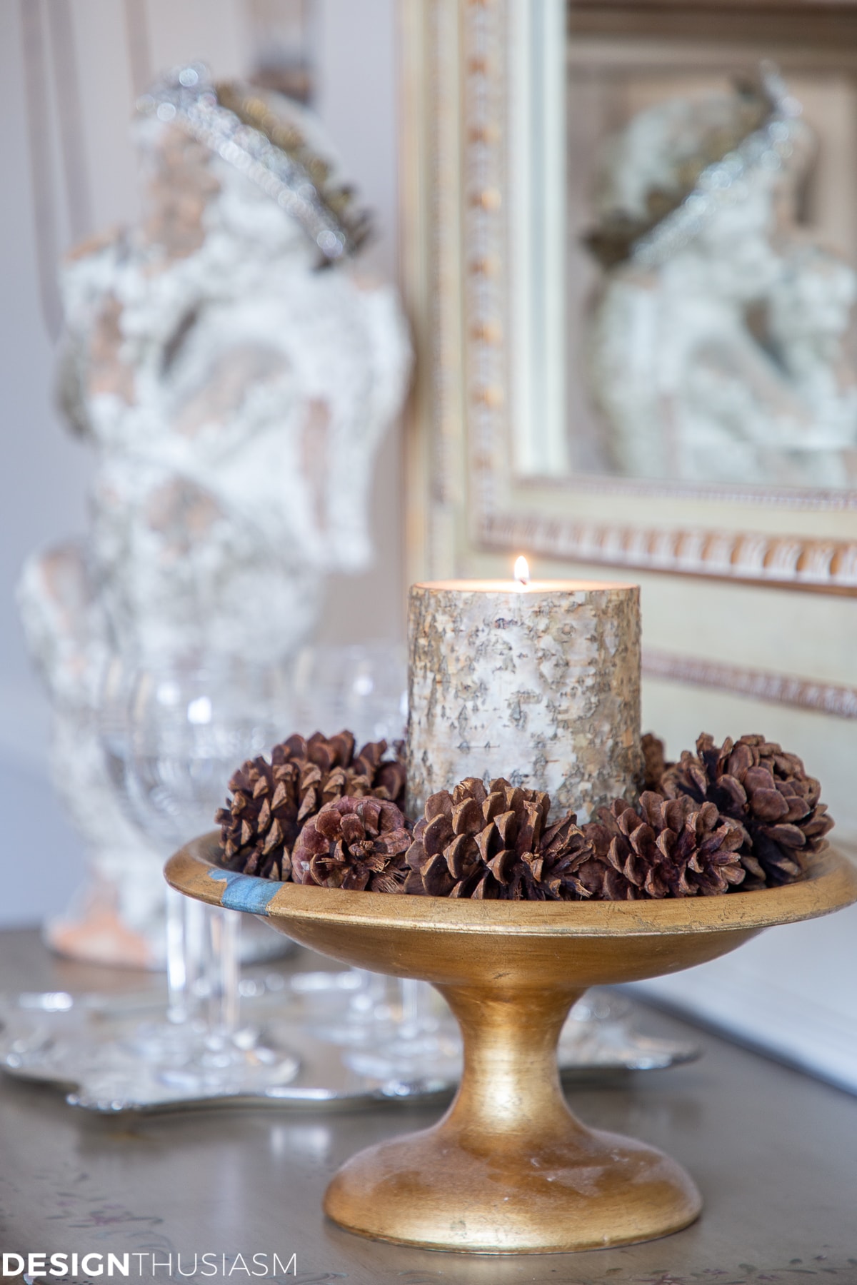 winter home accessories with bark candle and pine cones