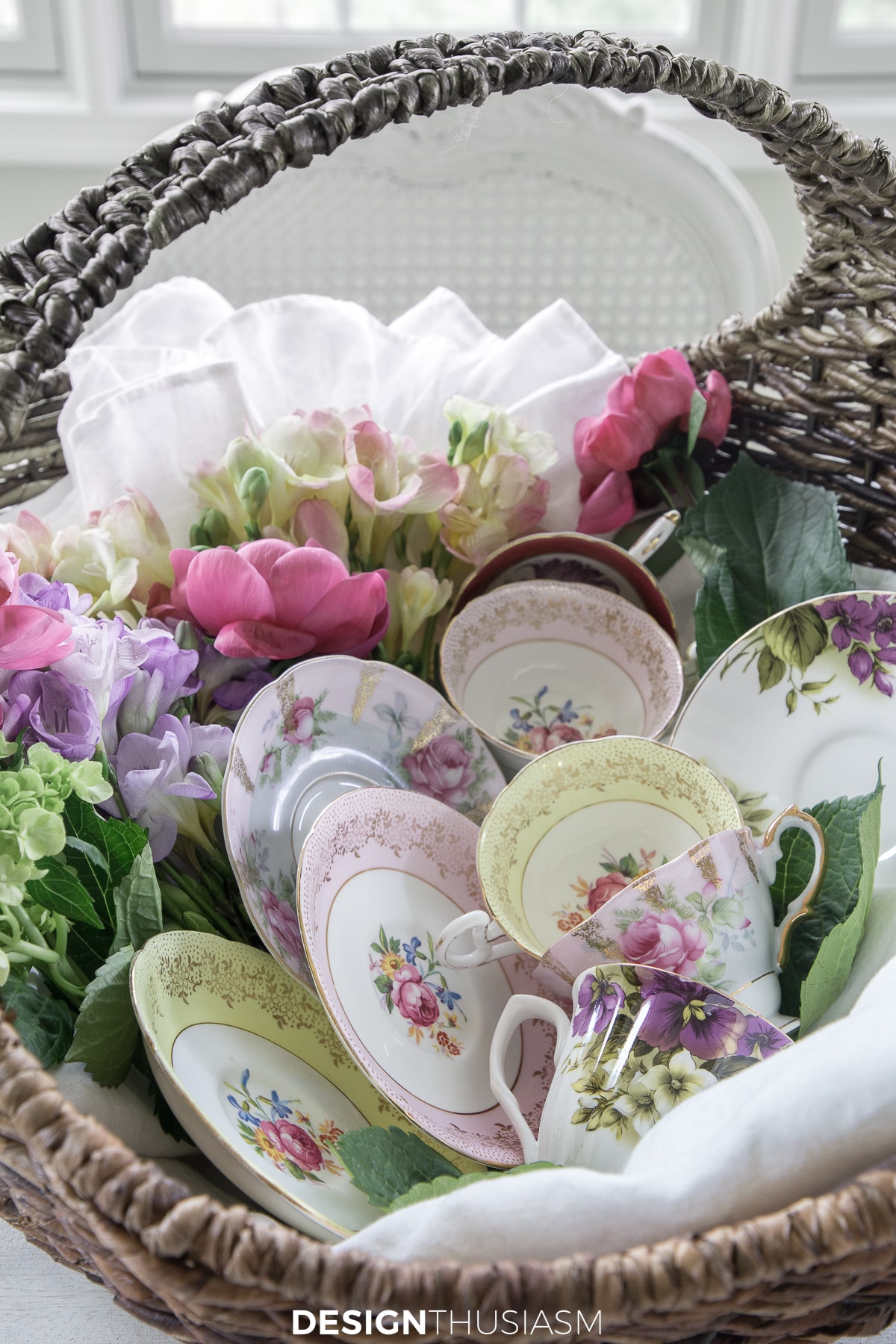 teacups displayed in a rattan basket