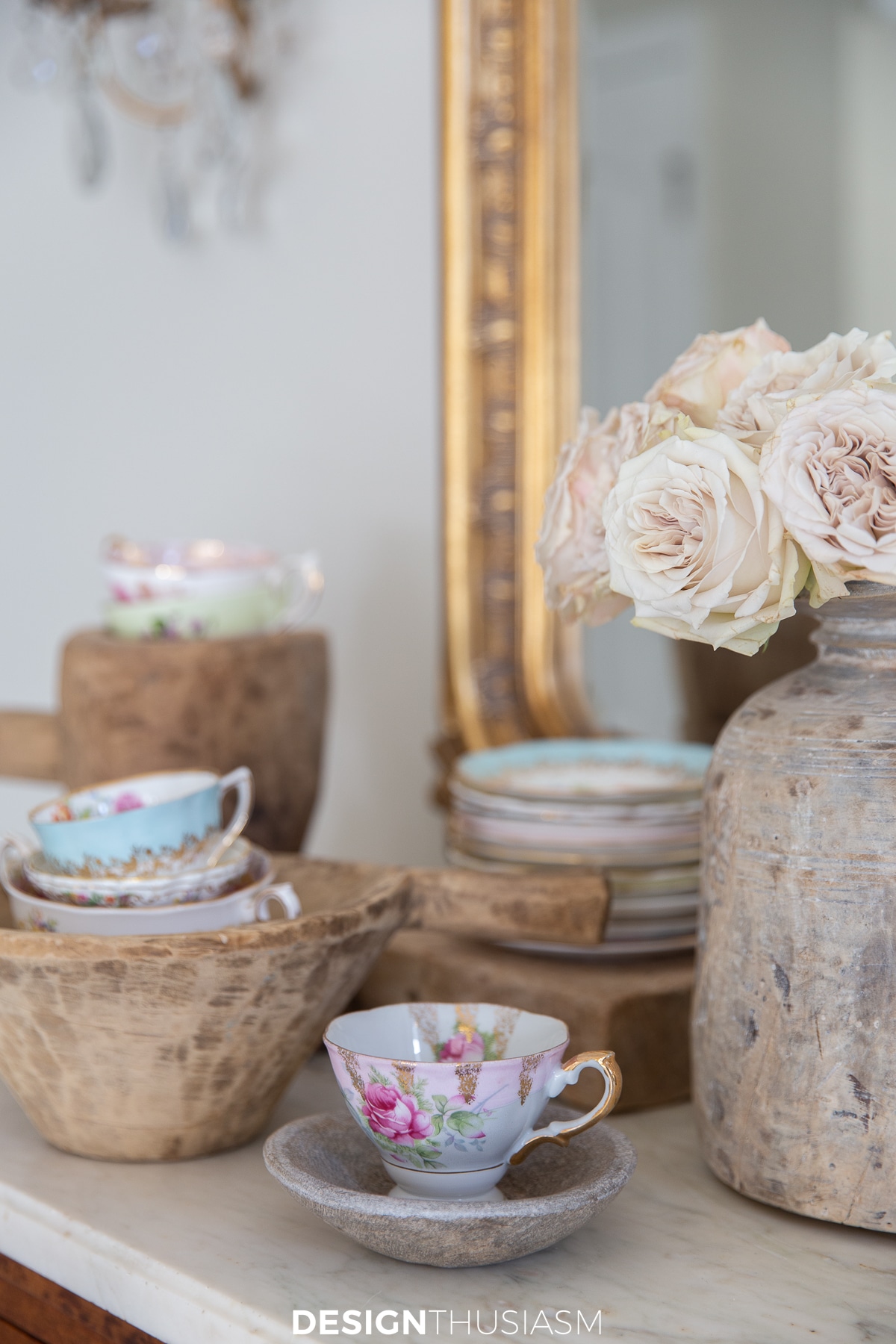 teacups displayed with vintage raw wood decor