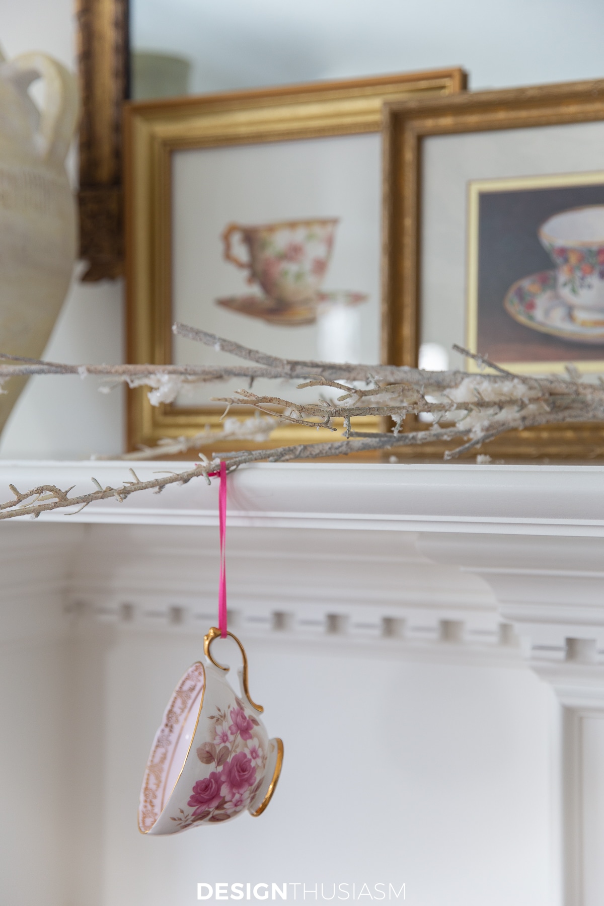 teacups displayed hanging from a branch