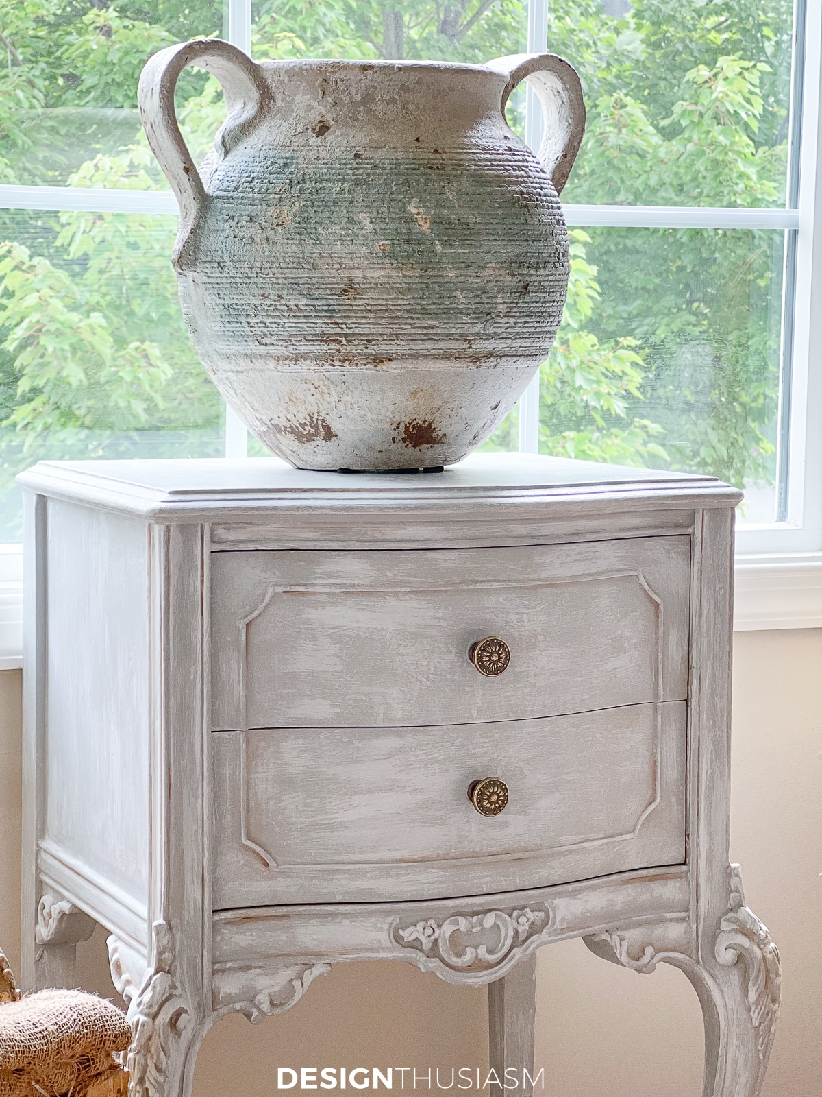 stairway nook petite table with distressed vase