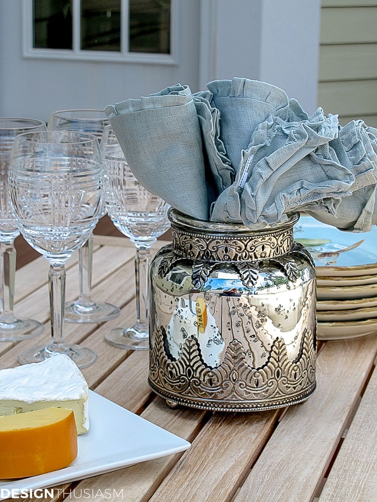 napkins in a vase on the patio