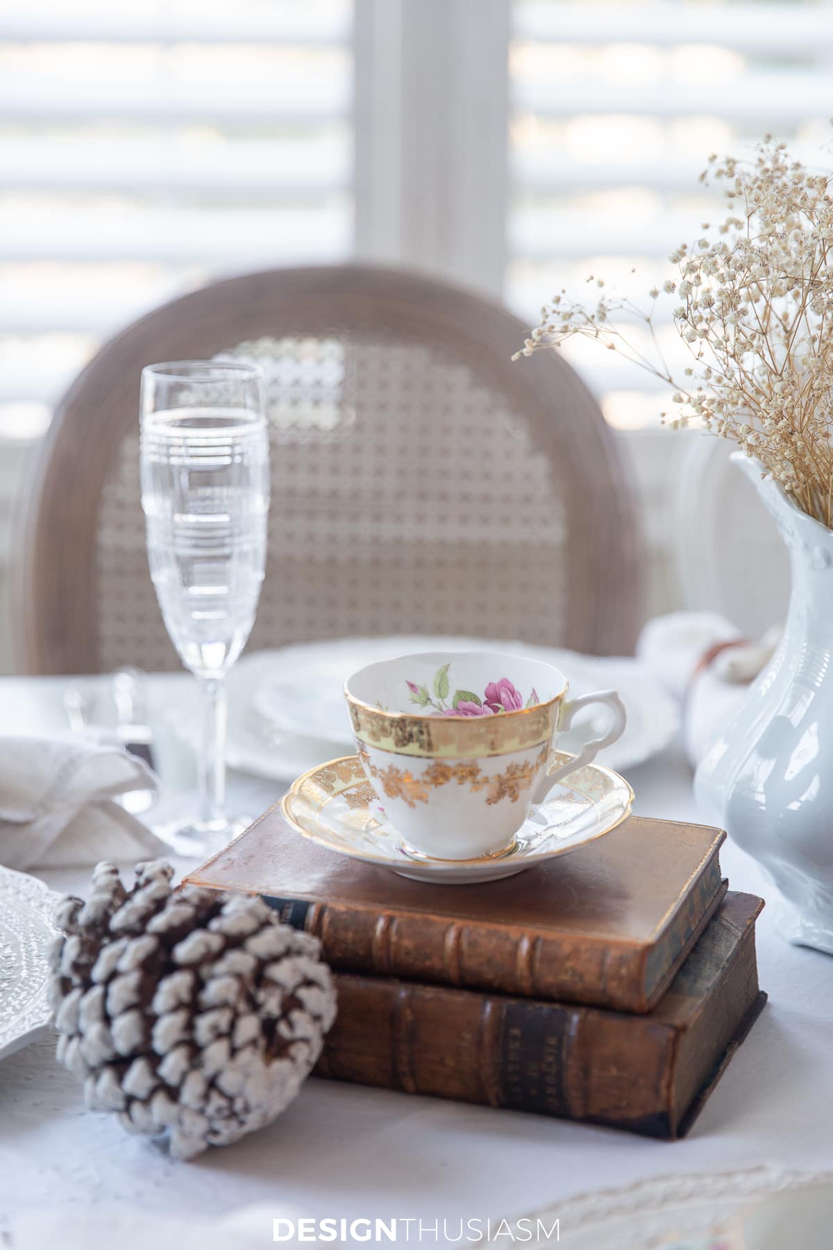 teacup on vintage books for afternoon tea table