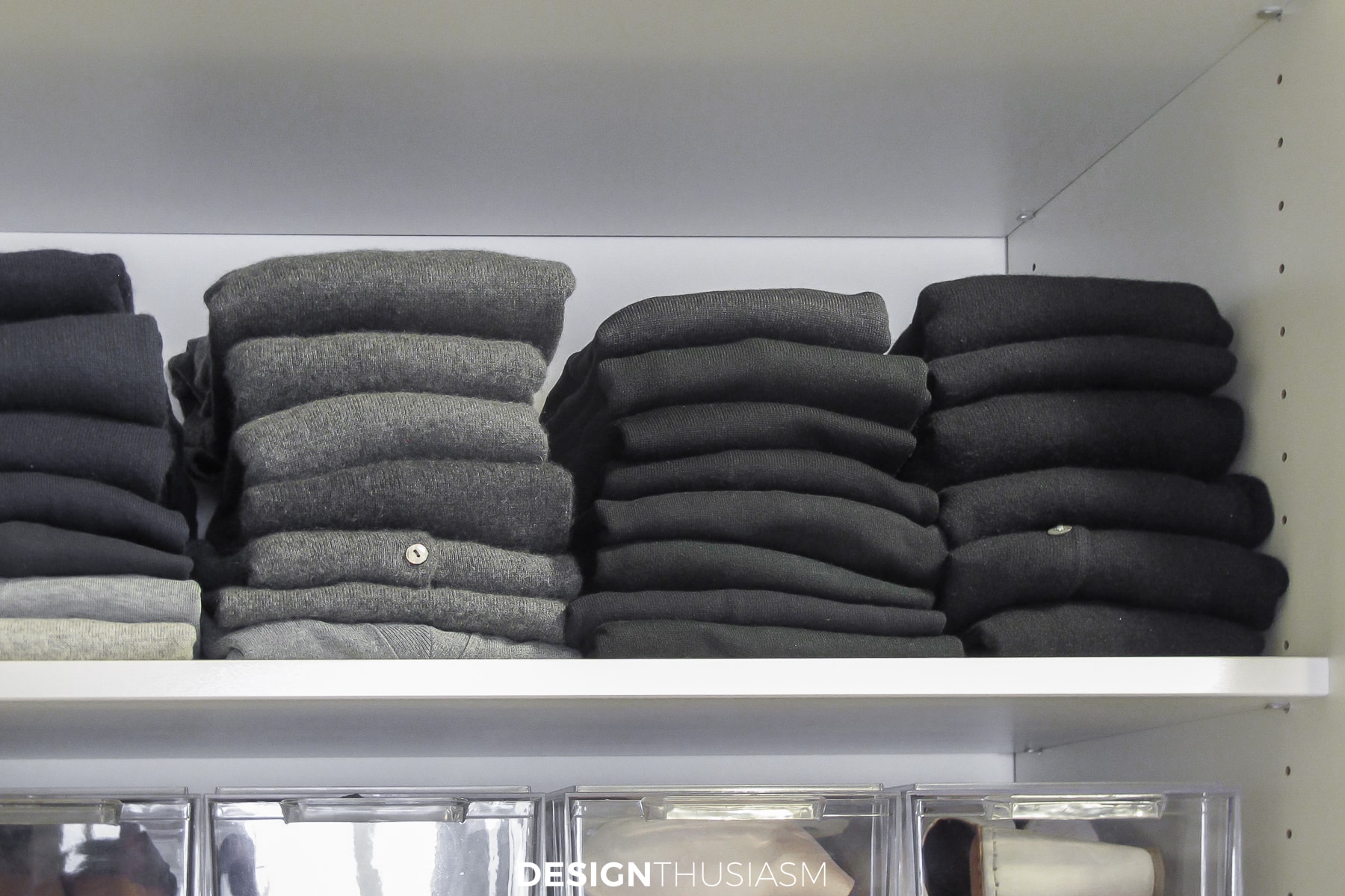 closet organization folded sweaters