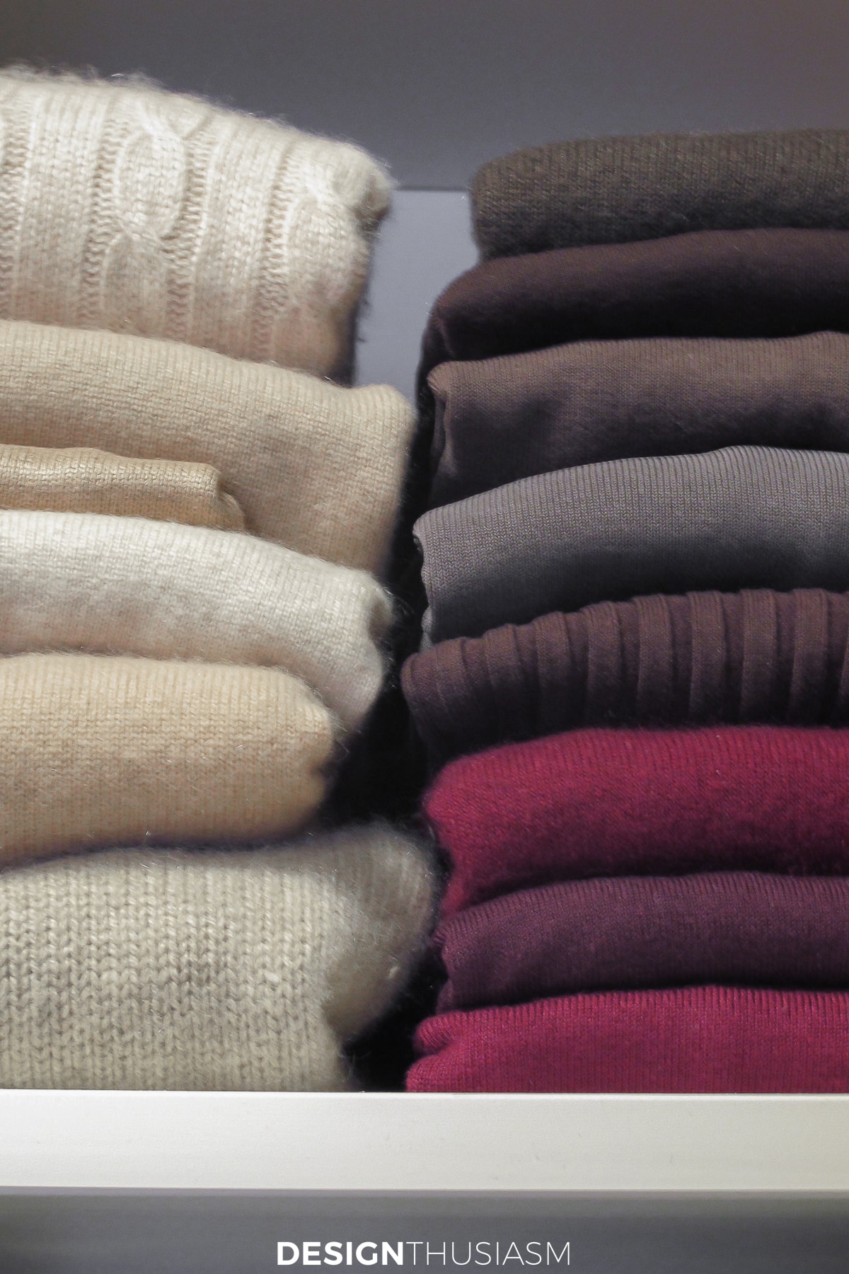 closet organization folded sweaters
