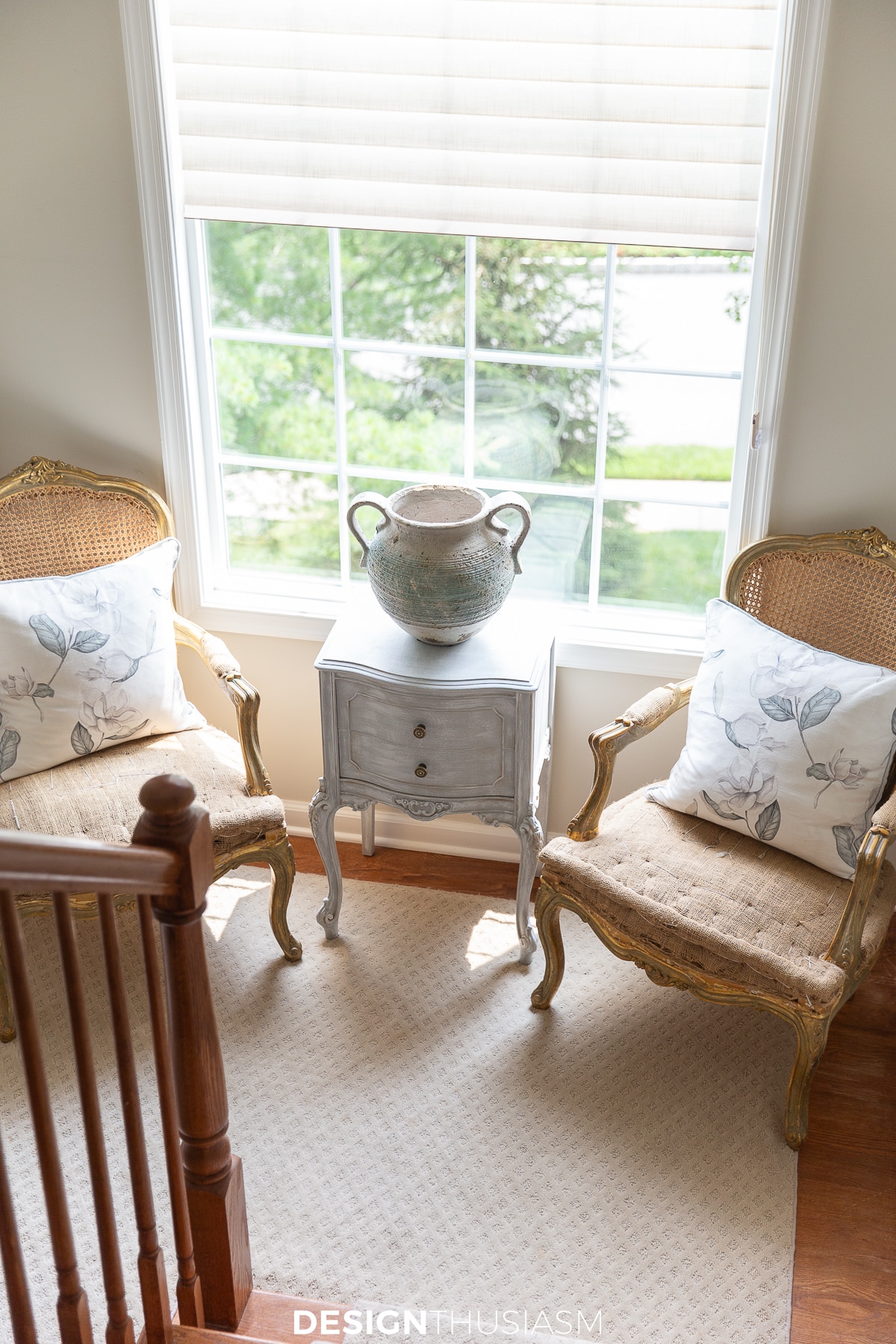 Defining style elements for a french inspired home - floral pillows on french chairs