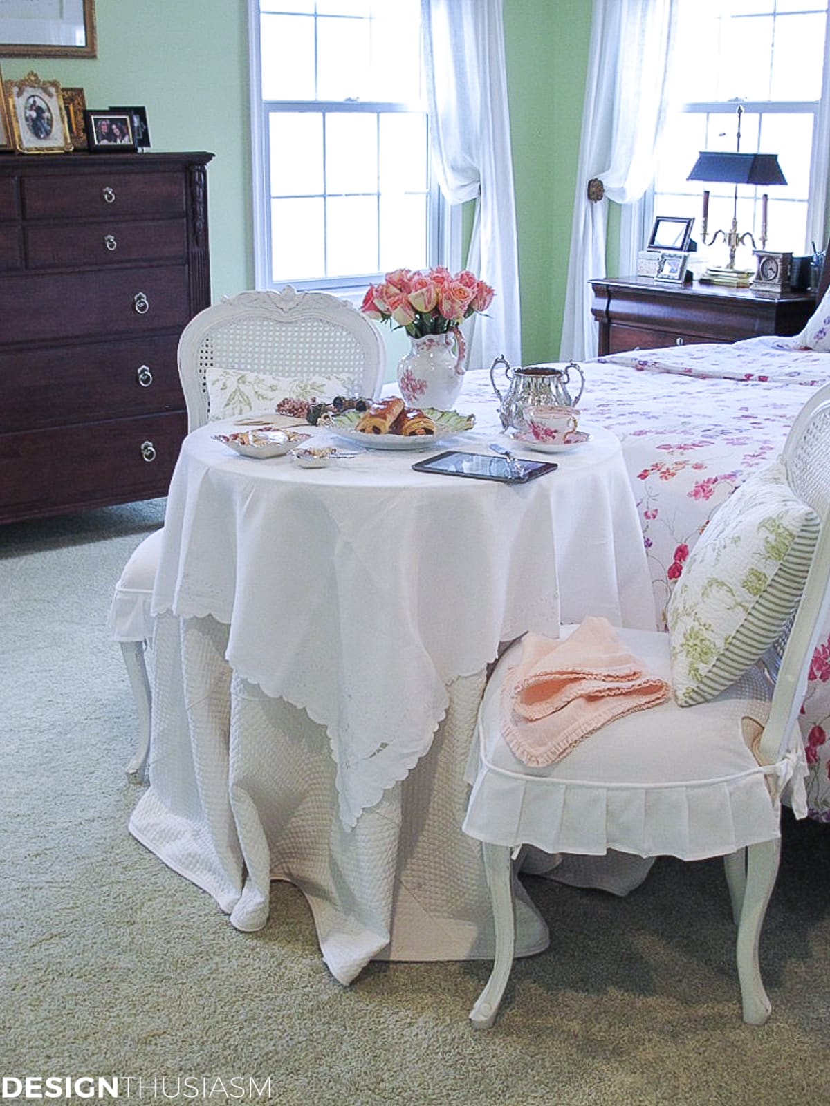 master bedroom with a french style bistro table for coffee