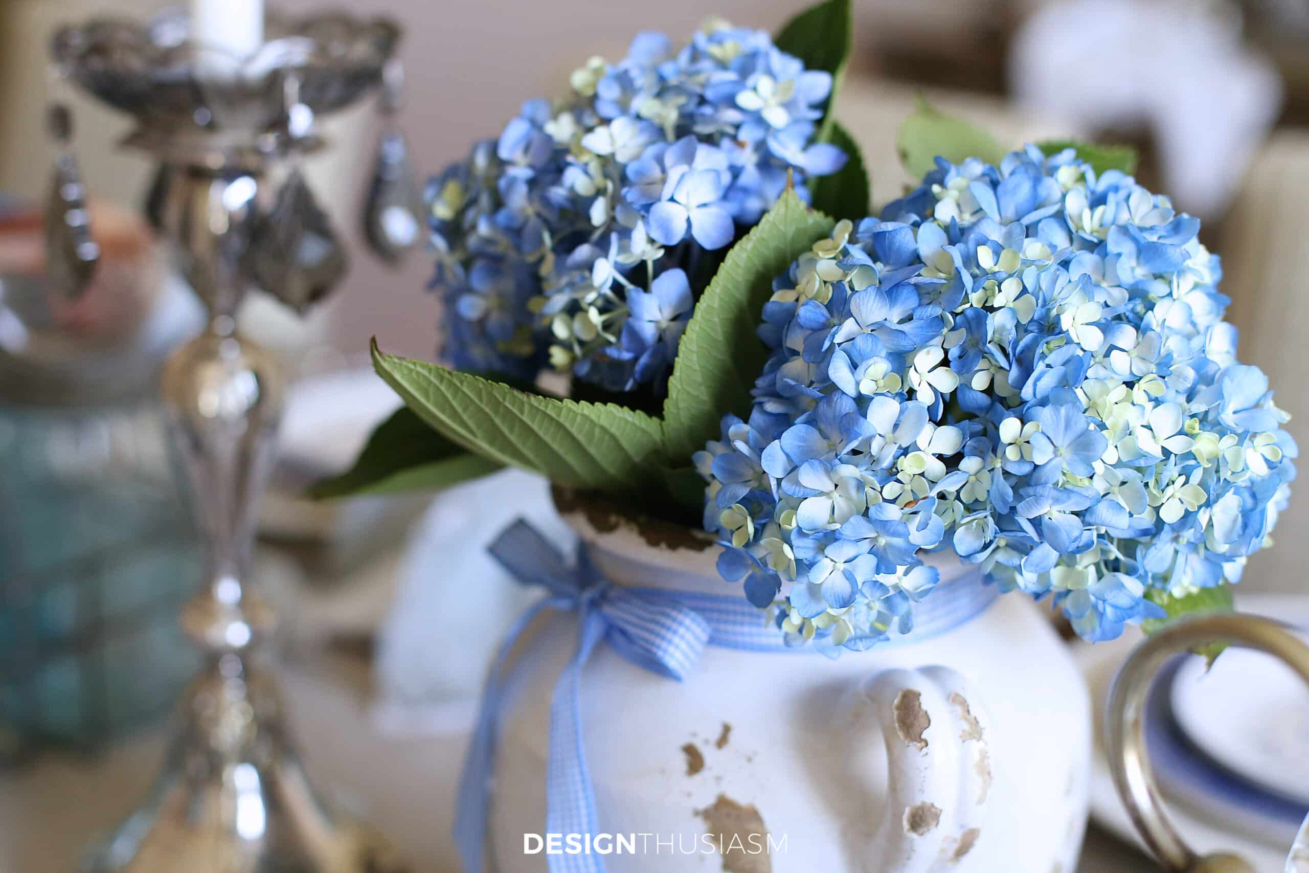 blue hydrangeas in a white vase