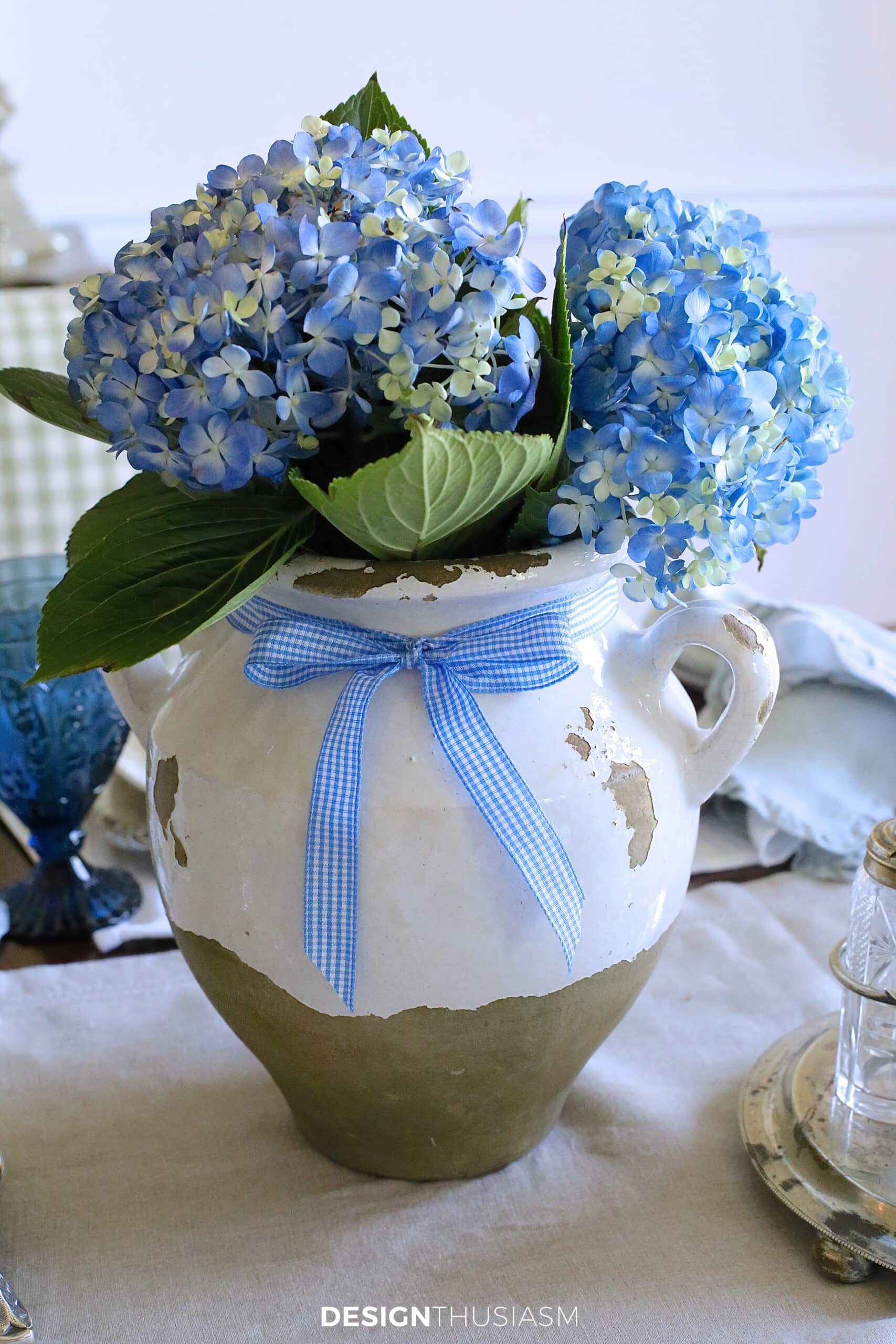 blue hydrangeas in a white vase