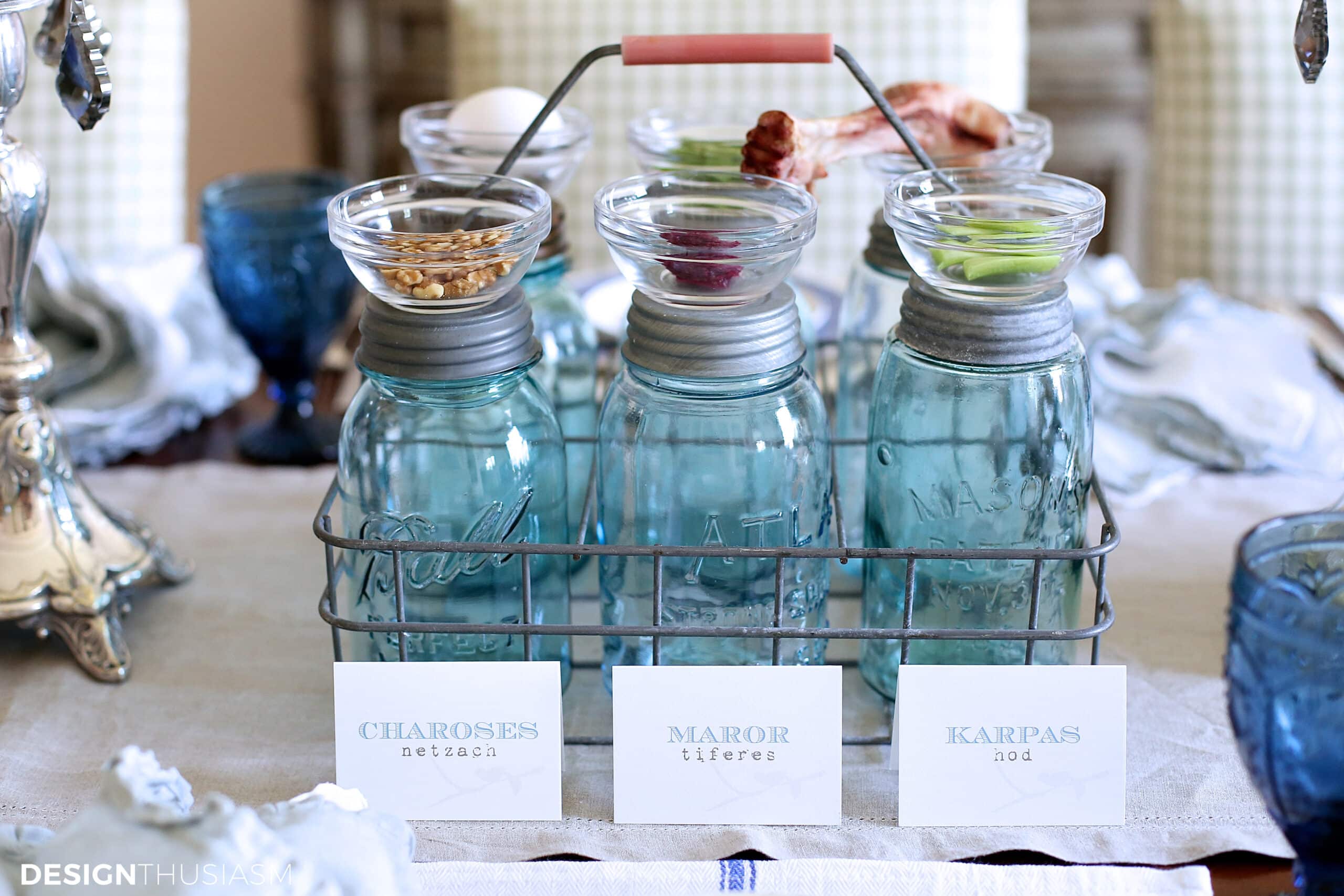 vintage blue mason jars used as a seder plate