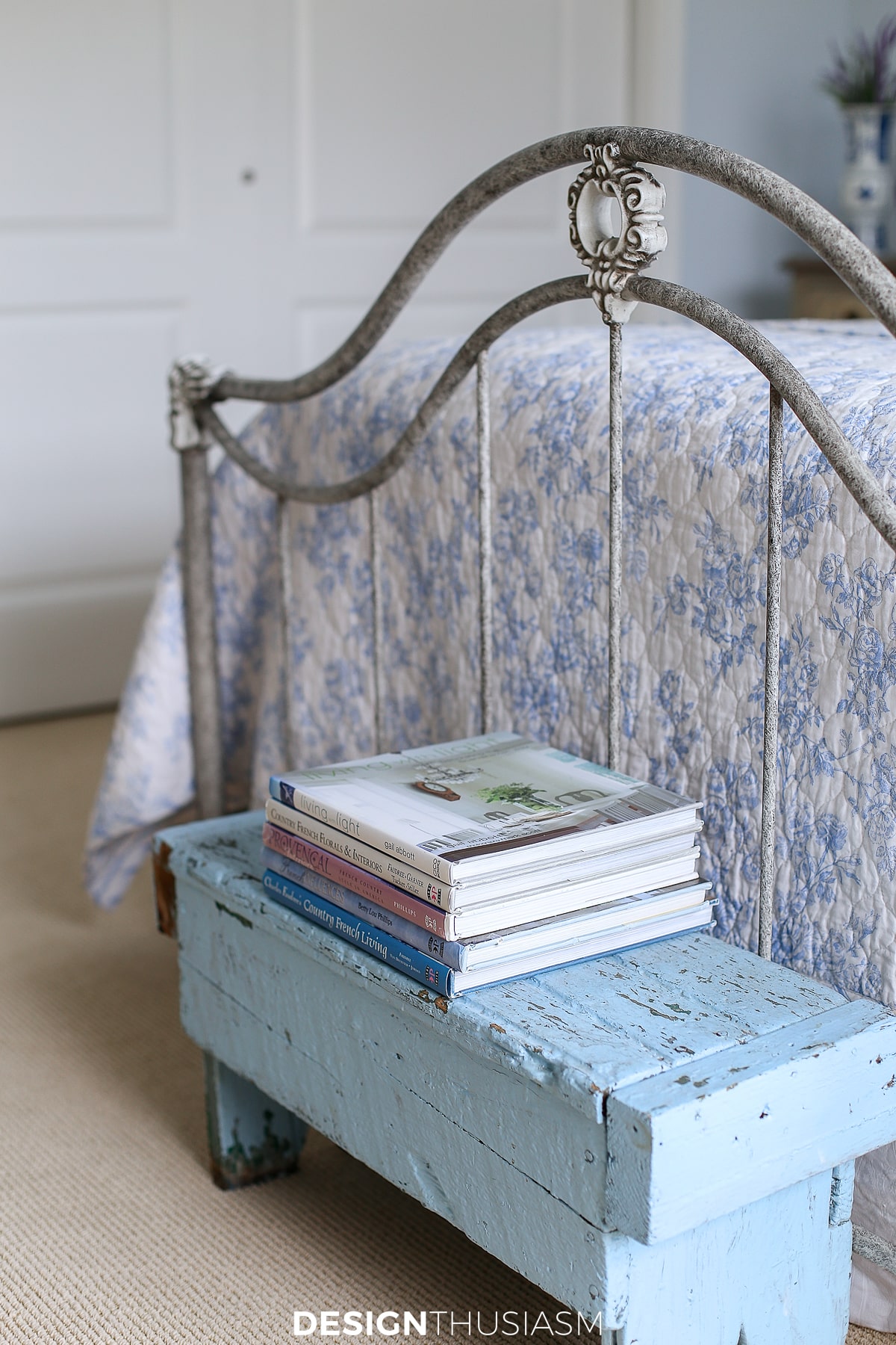 french blue bedroom end of bed bench with books