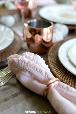 pink napkins on neutral fall tablescape