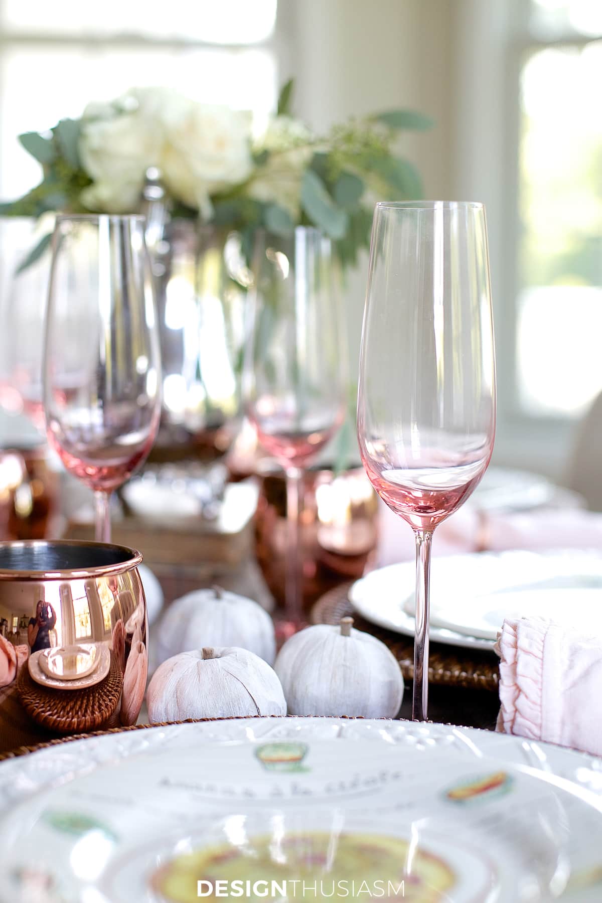 pink champagne flutes on neutral fall tablescape