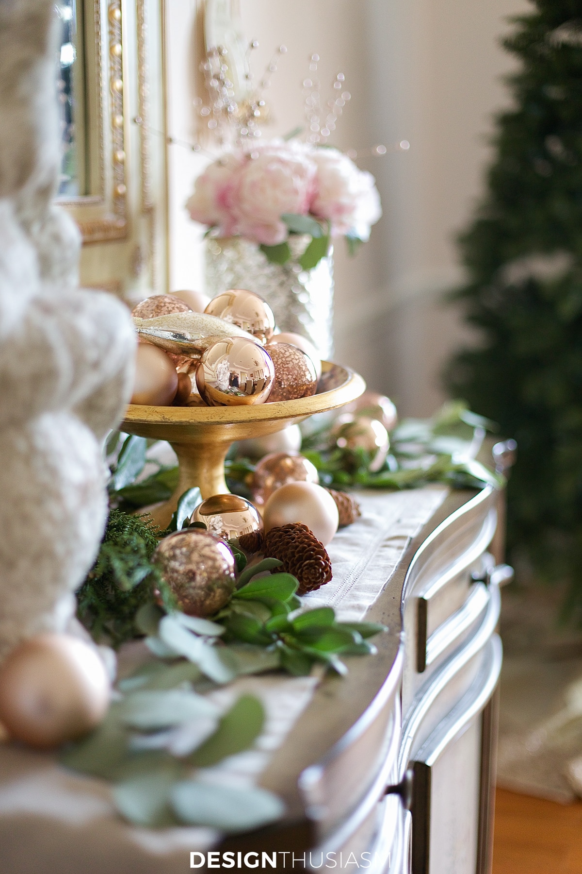 Rose gold Christmas ornaments on the buffet