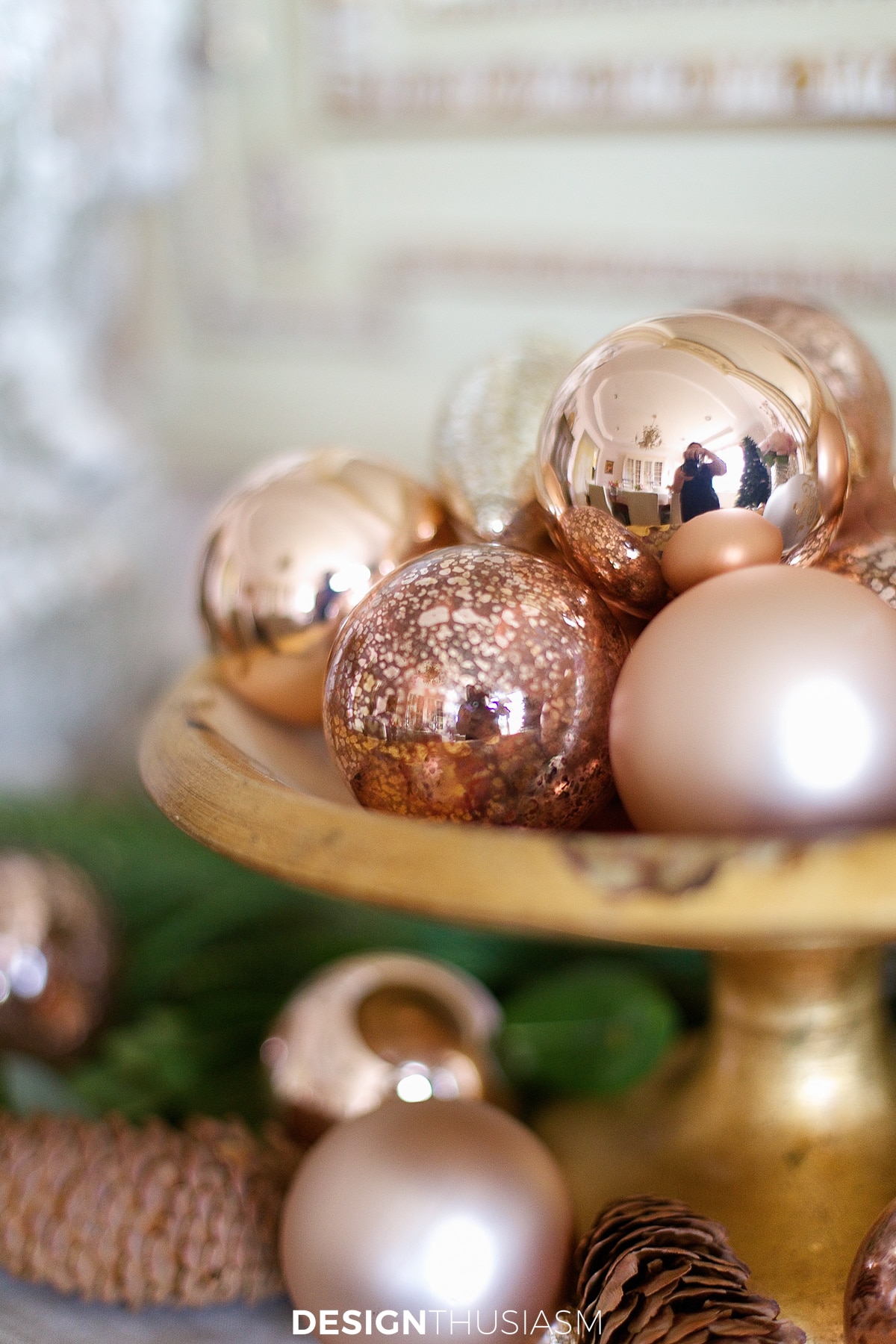 Rose gold Christmas decorations in a bowl