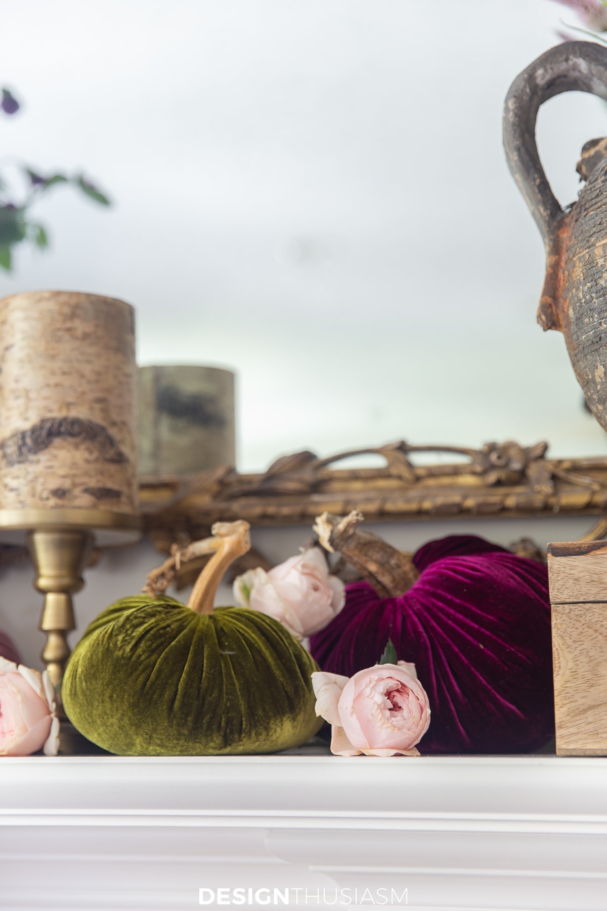 velvet pumpkins and roses on family room mantel