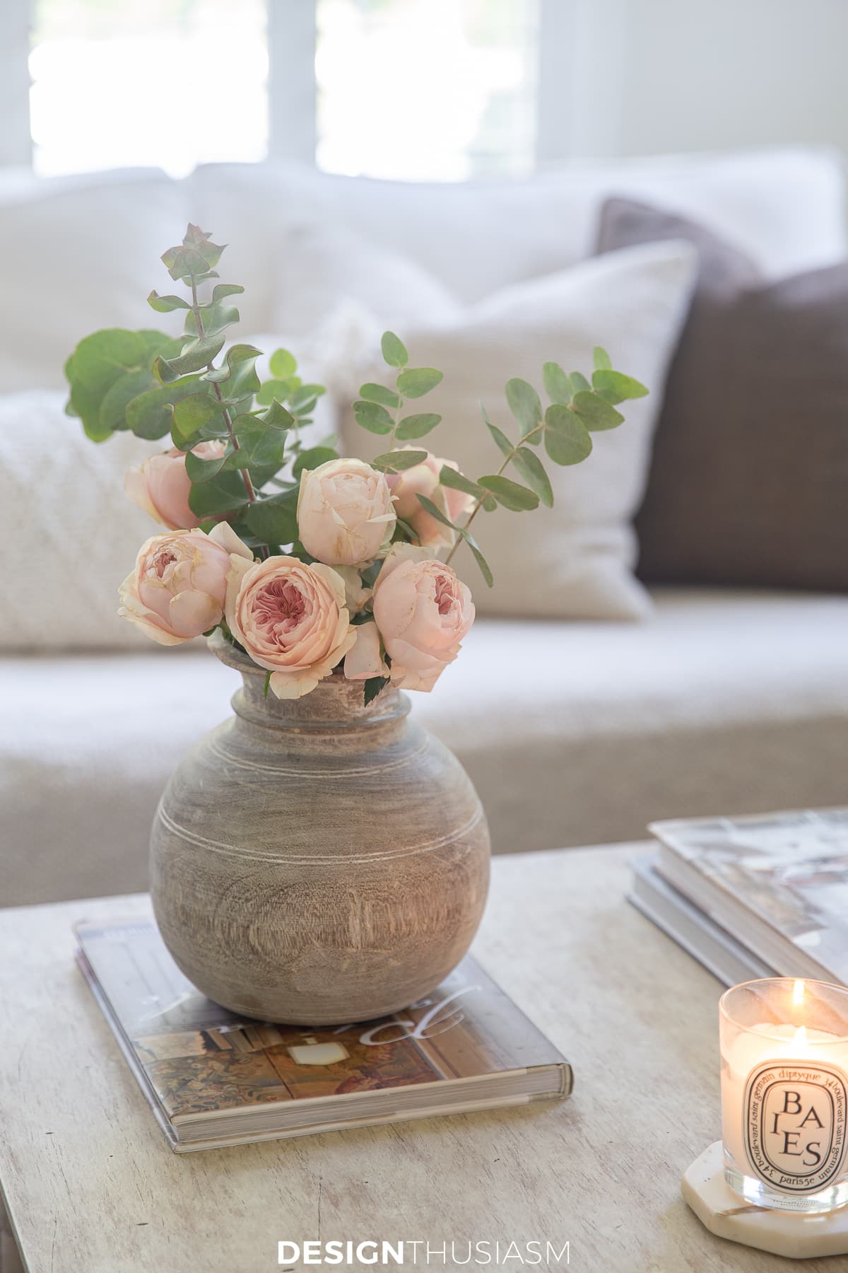 wood vase floral and berry candle in a fall family room