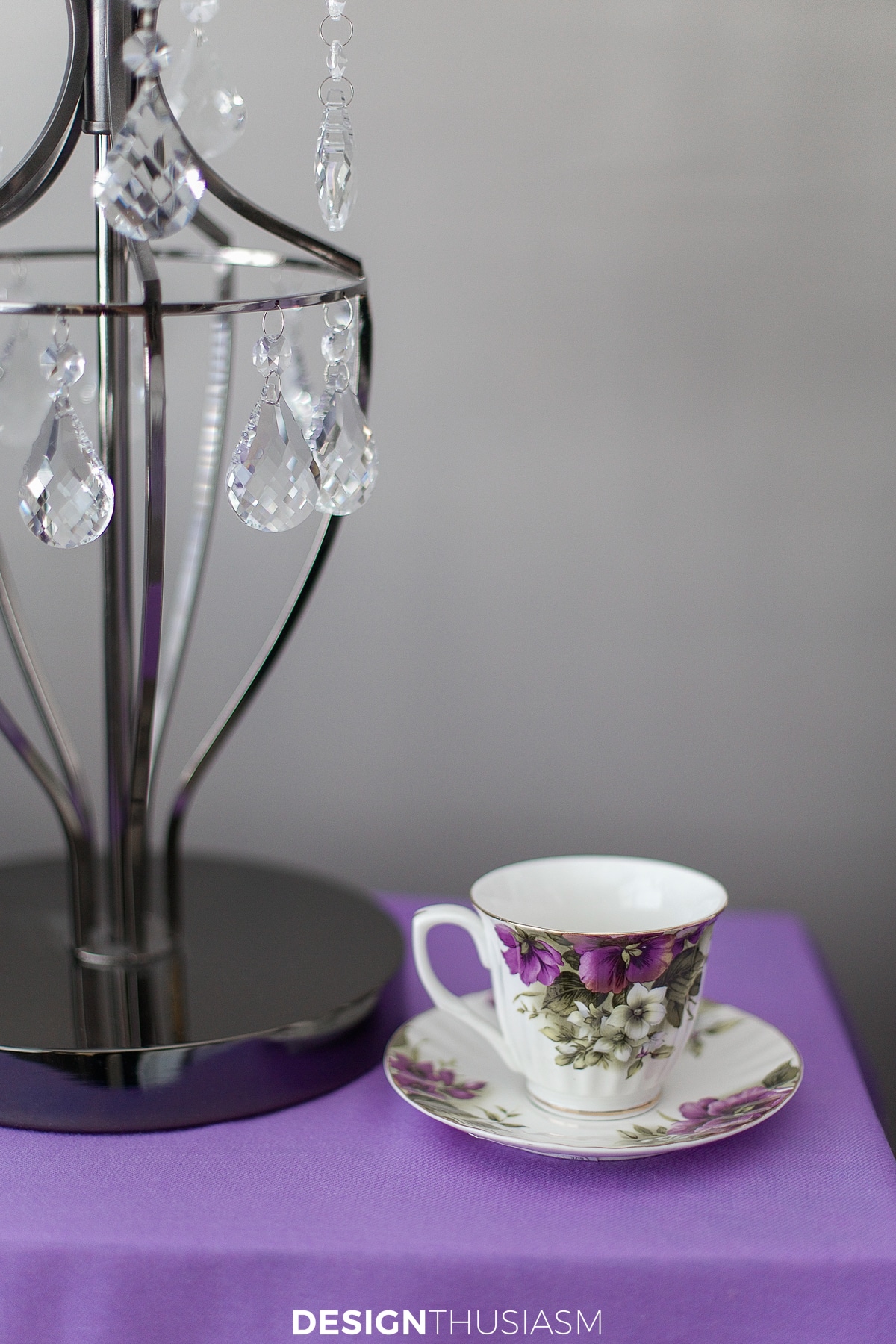 nightstand in the lilac and grey bedroom