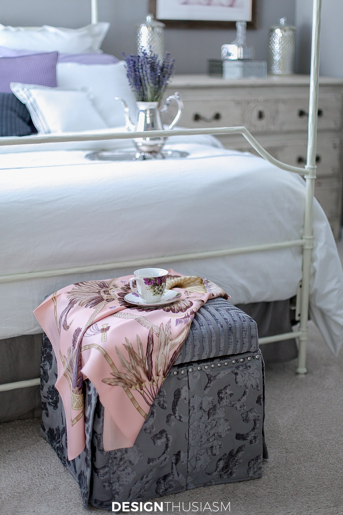 ottoman in the lilac and grey bedroom