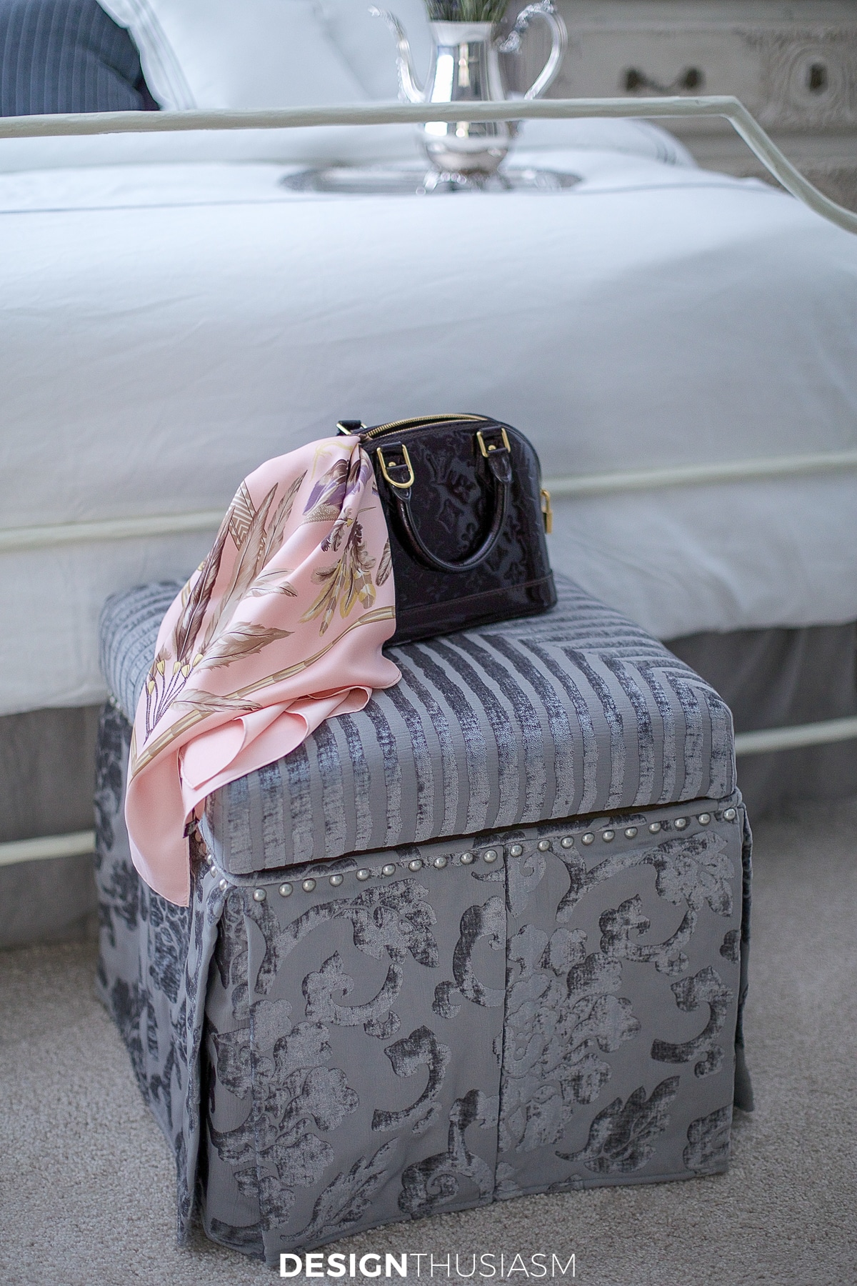 ottoman in the lilac and grey bedroom