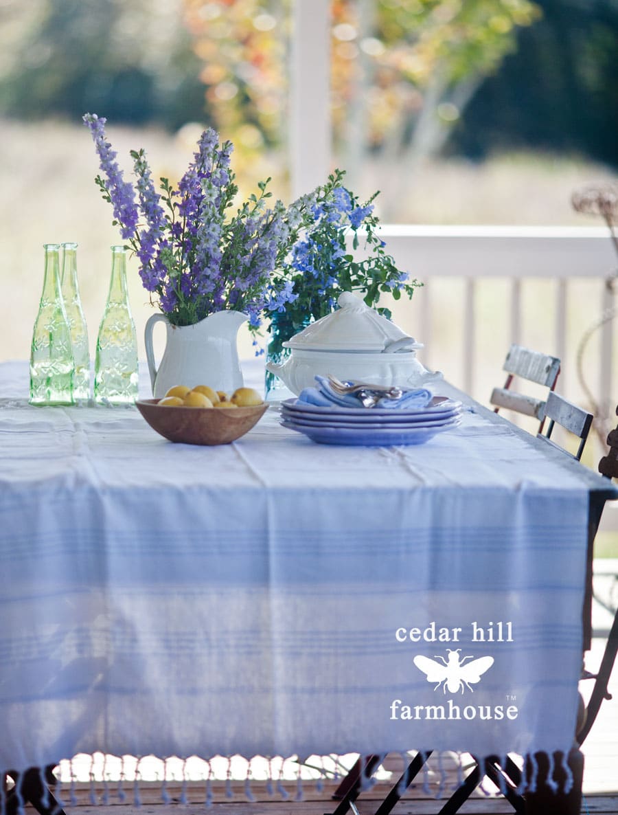 pine-table-with-blue-flowers