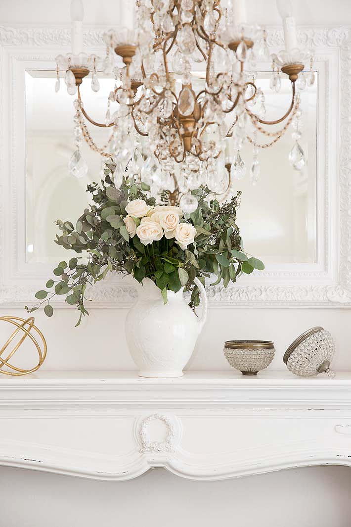 white roses on a mantel