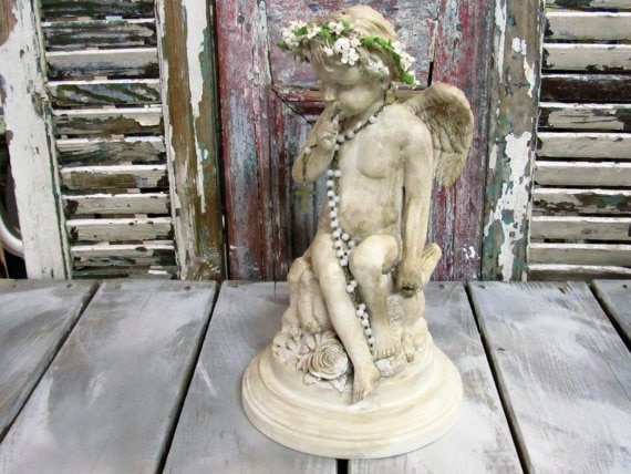 Rustic cherub statue