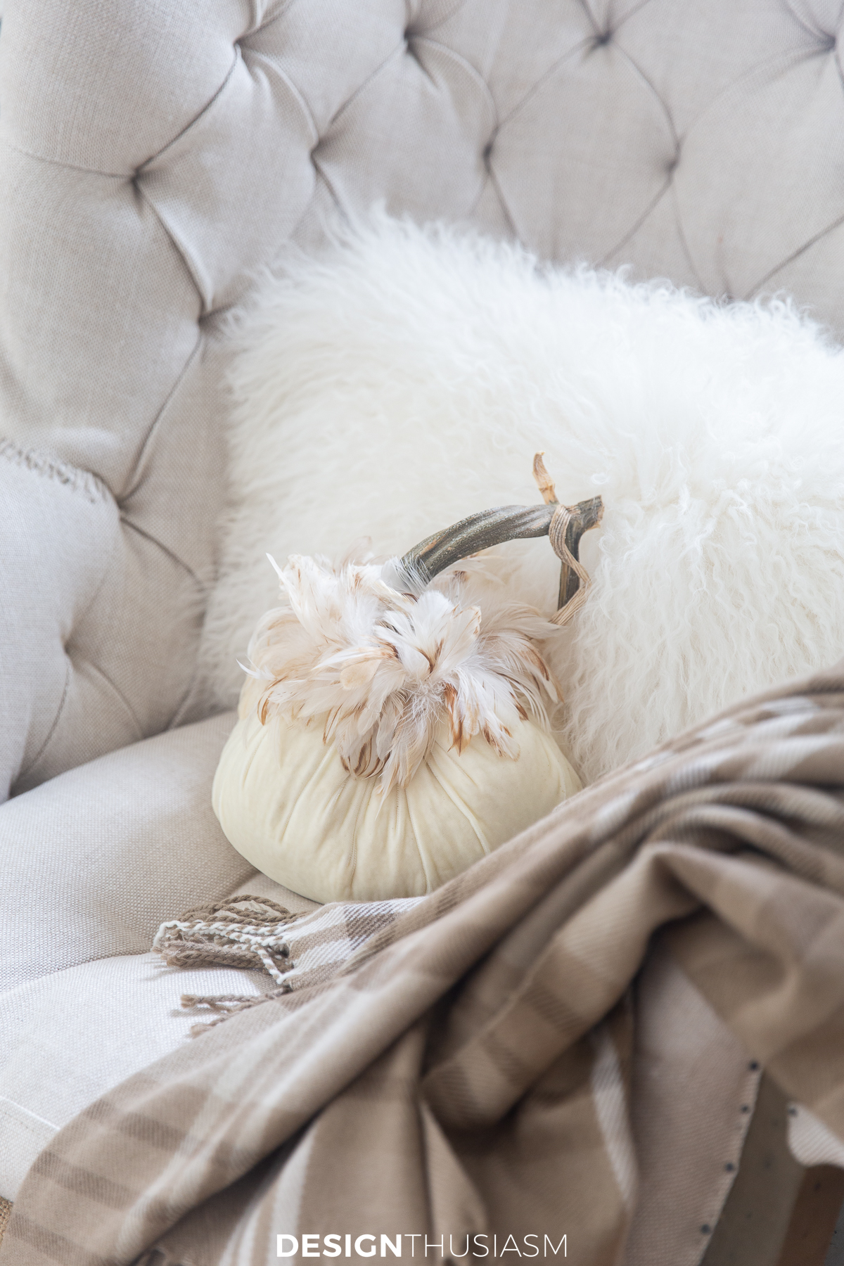 soft fall decor using velvet pumpkins, faux fur, and a subtle plaid