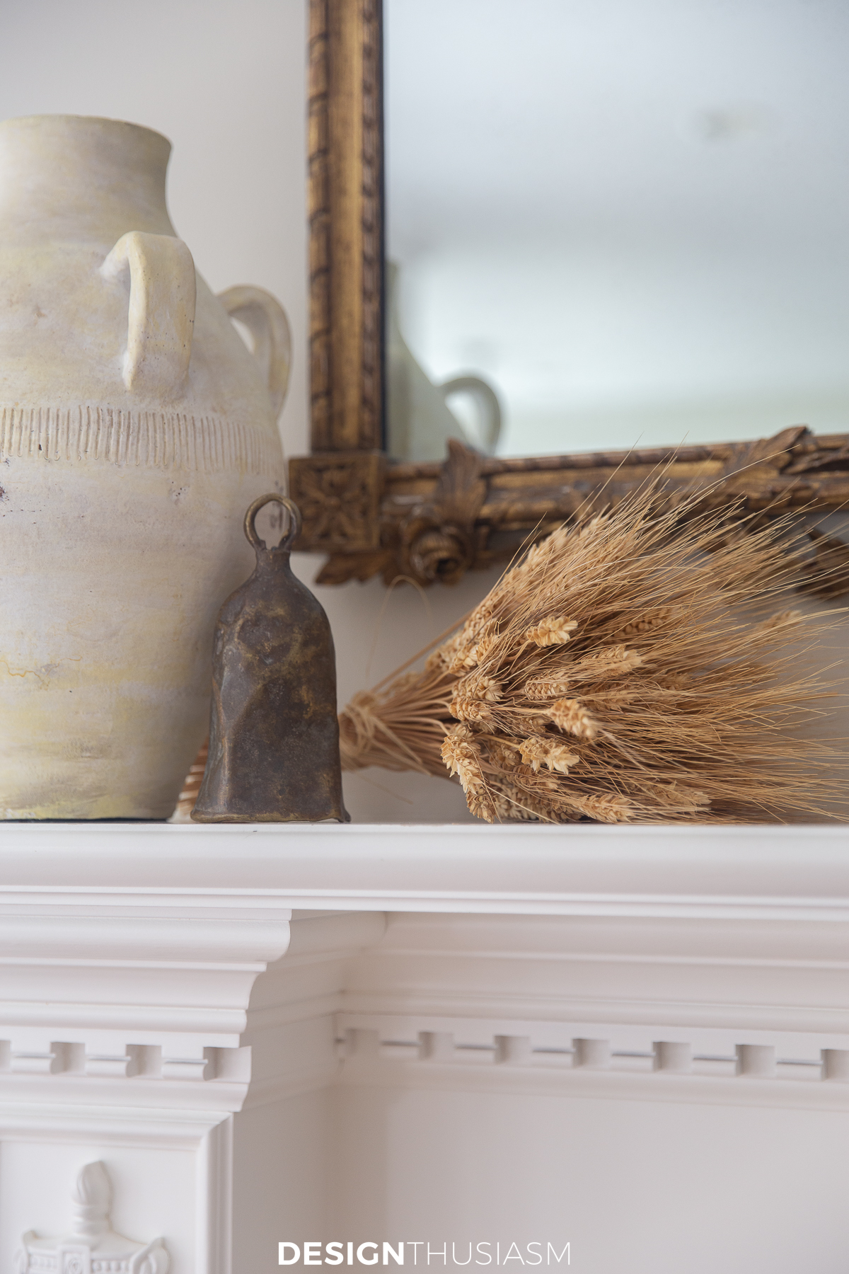 fall decor on the mantel using wheatstalks