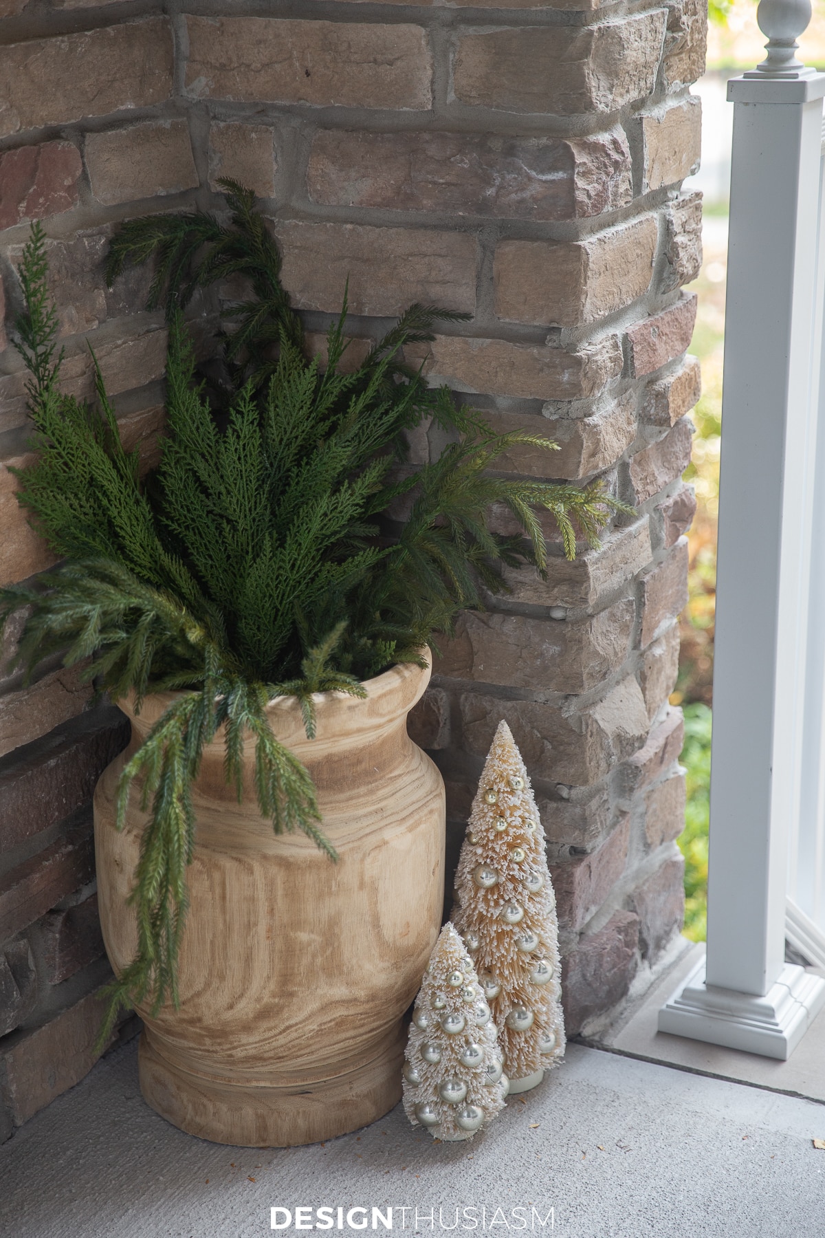 Tiny Christmas porch greenery in wood vase