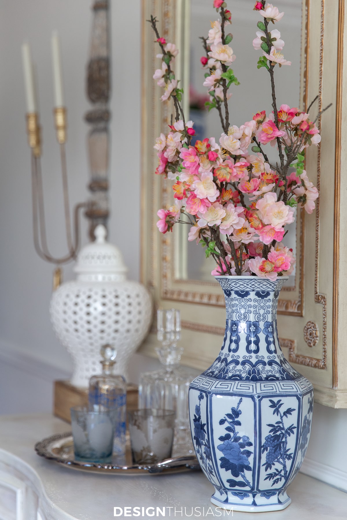 cherry blossoms in a blue and white vase