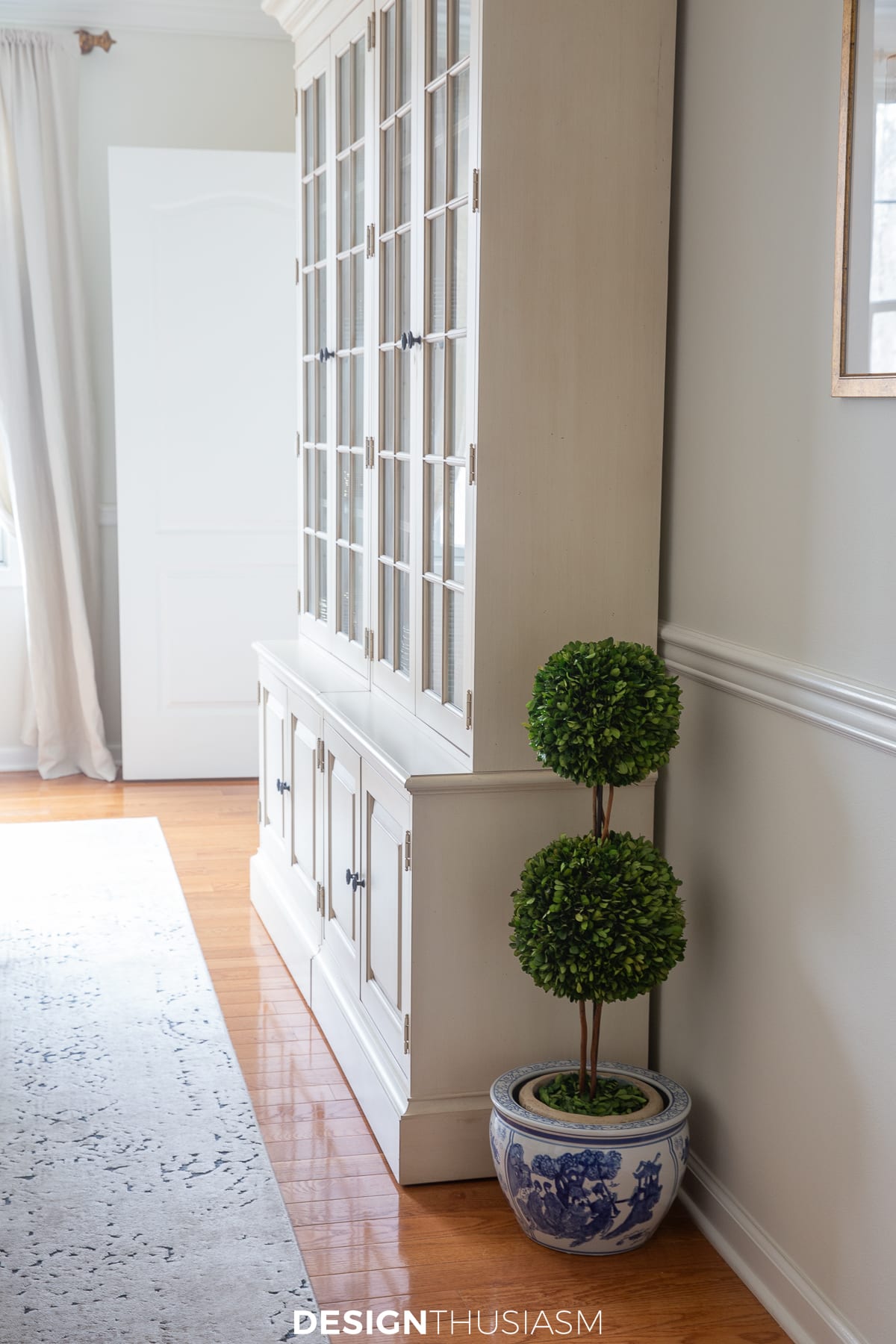 topiary in blue and white porcelain planter