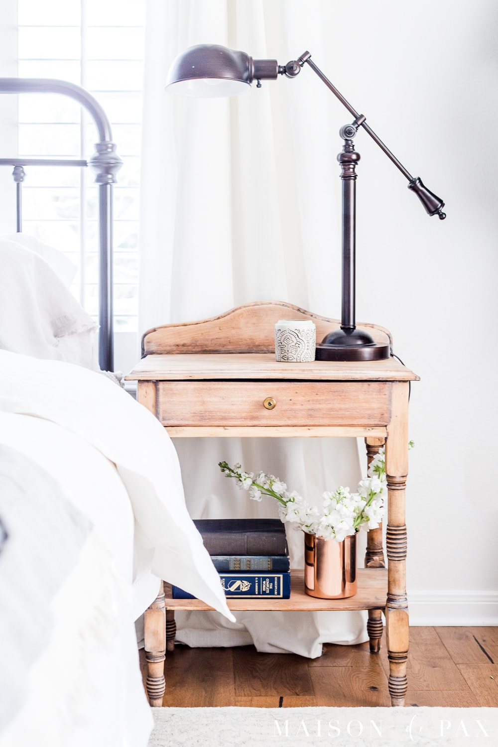 White modern farmhouse master bedroom decorated for spring