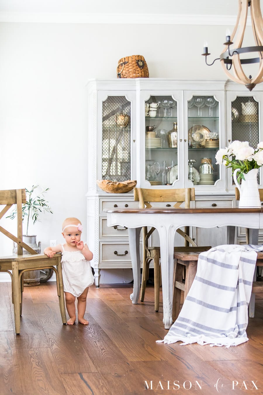 simple summer dining room with peony centerpiece