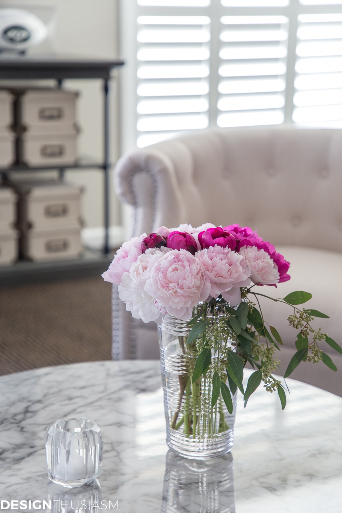 basement finishing with plantation shutters on doors and flowers on table