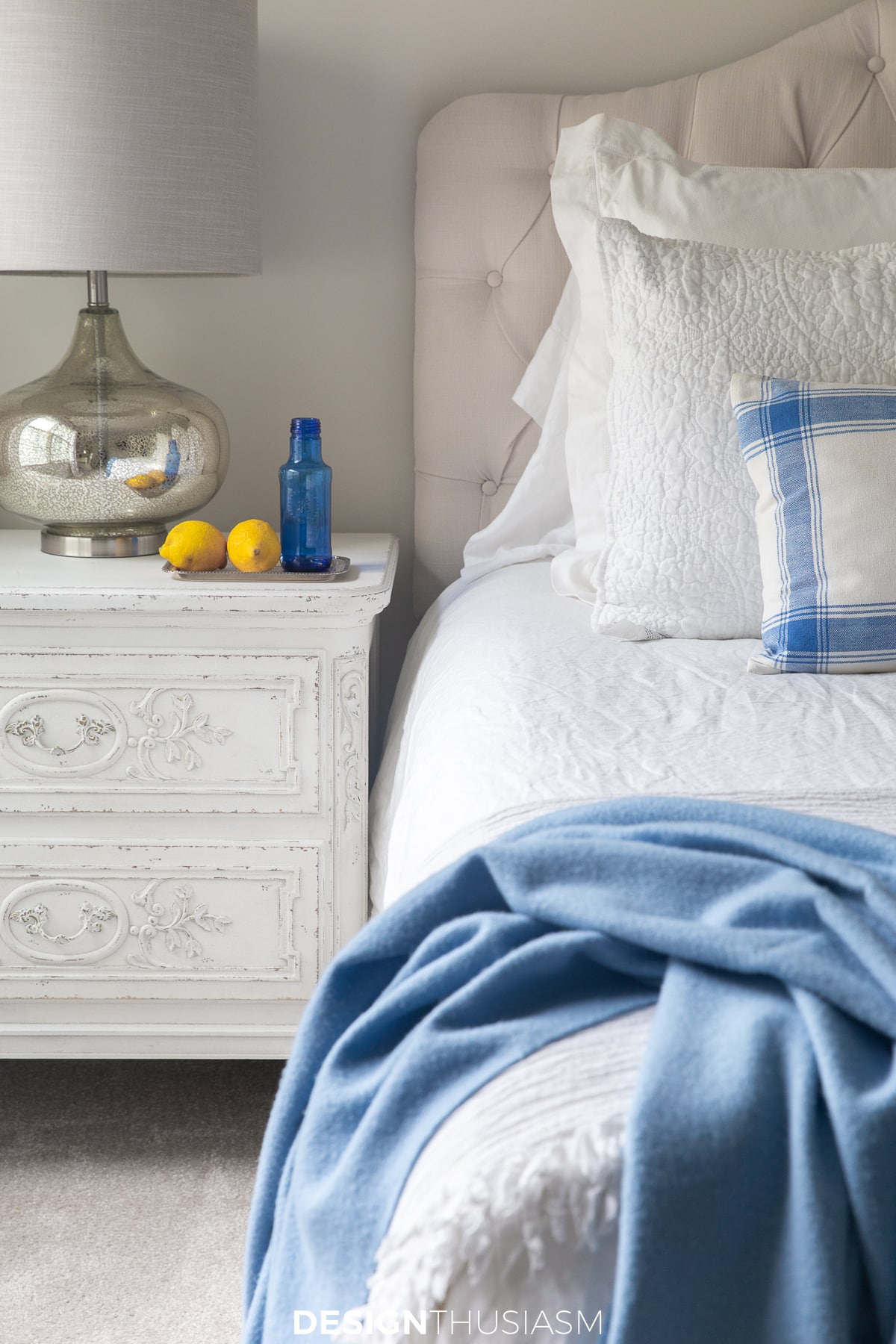 guest room ideas lemons and water on the bedside table