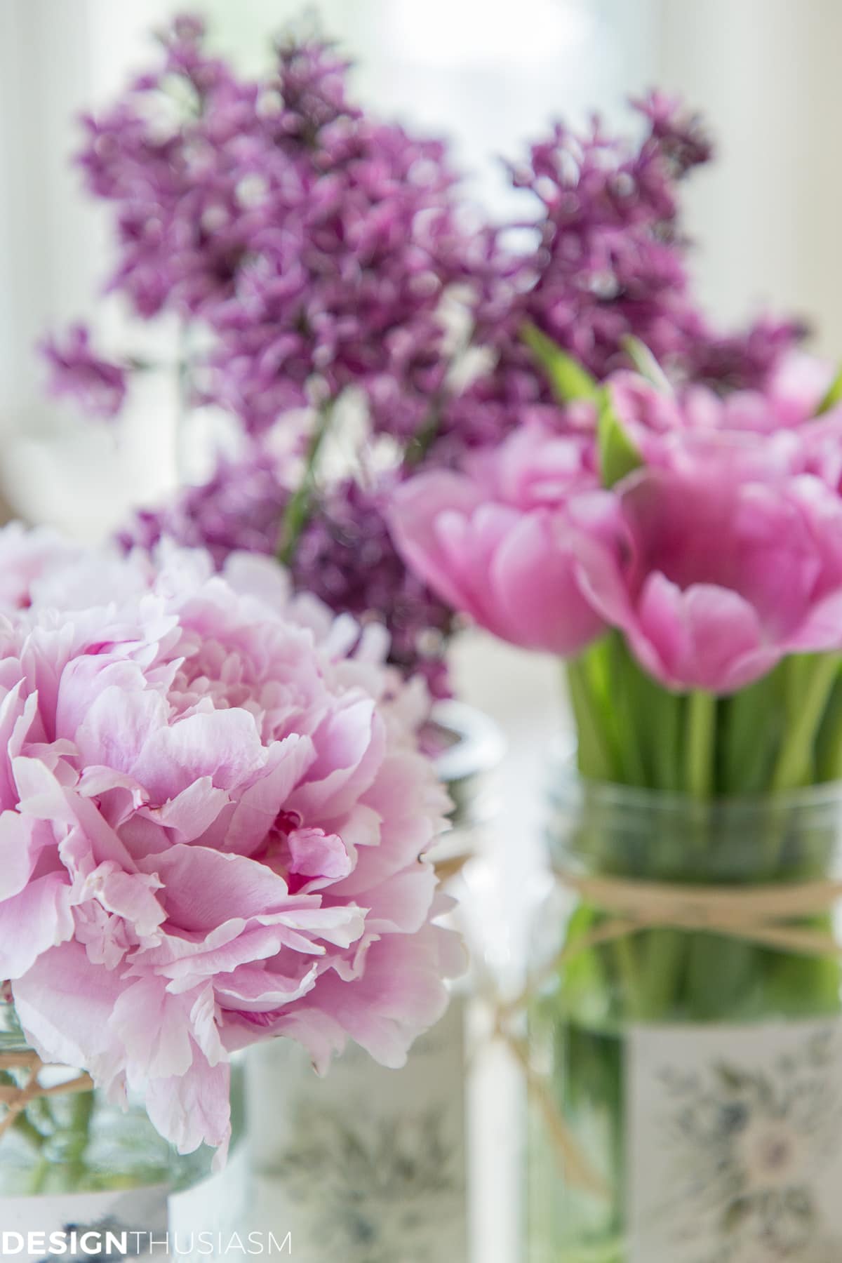 peonies, tulips and lilacs in mason jars