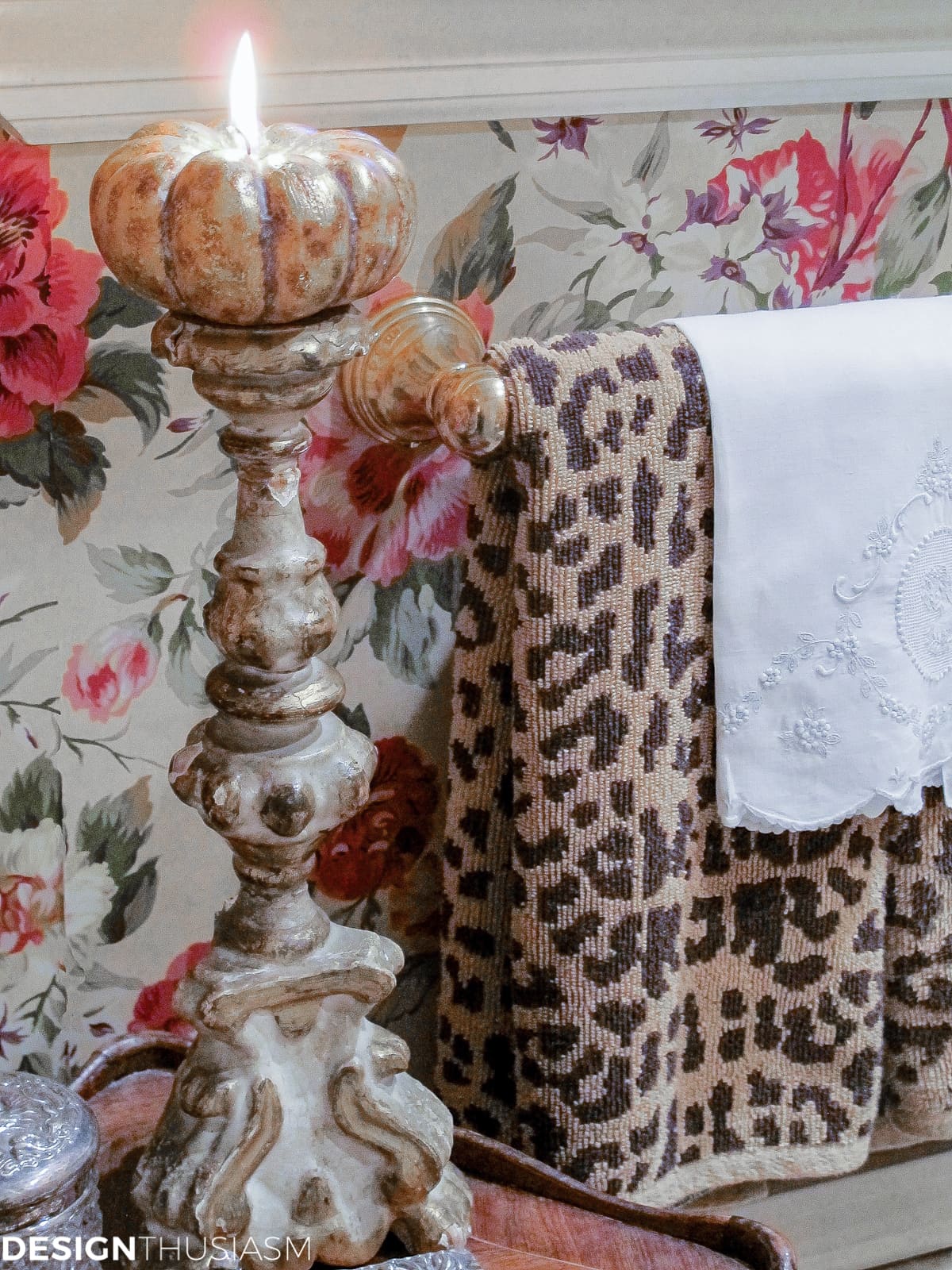 autumn decor in the powder room with pumpkin candles