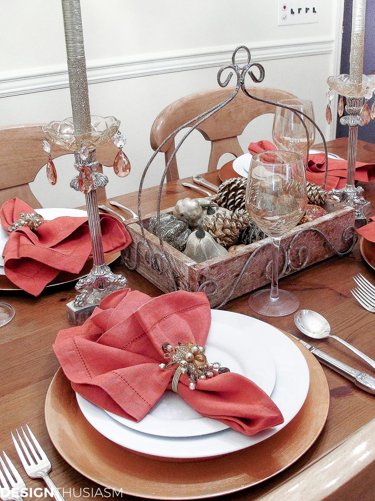 casual fall table setting with rust napkins, pumpkins and gourds