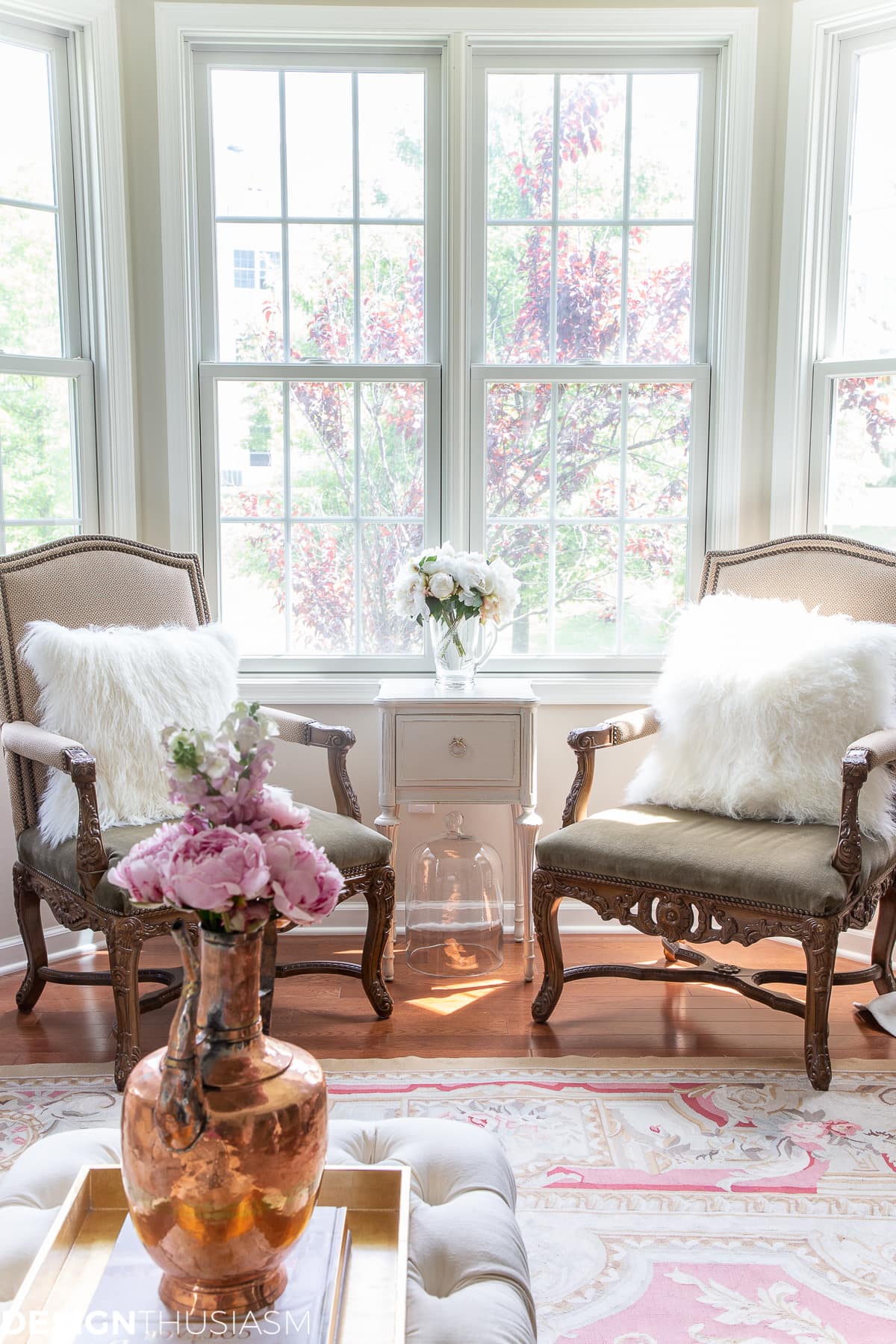 living room decor with a pair of throne chairs