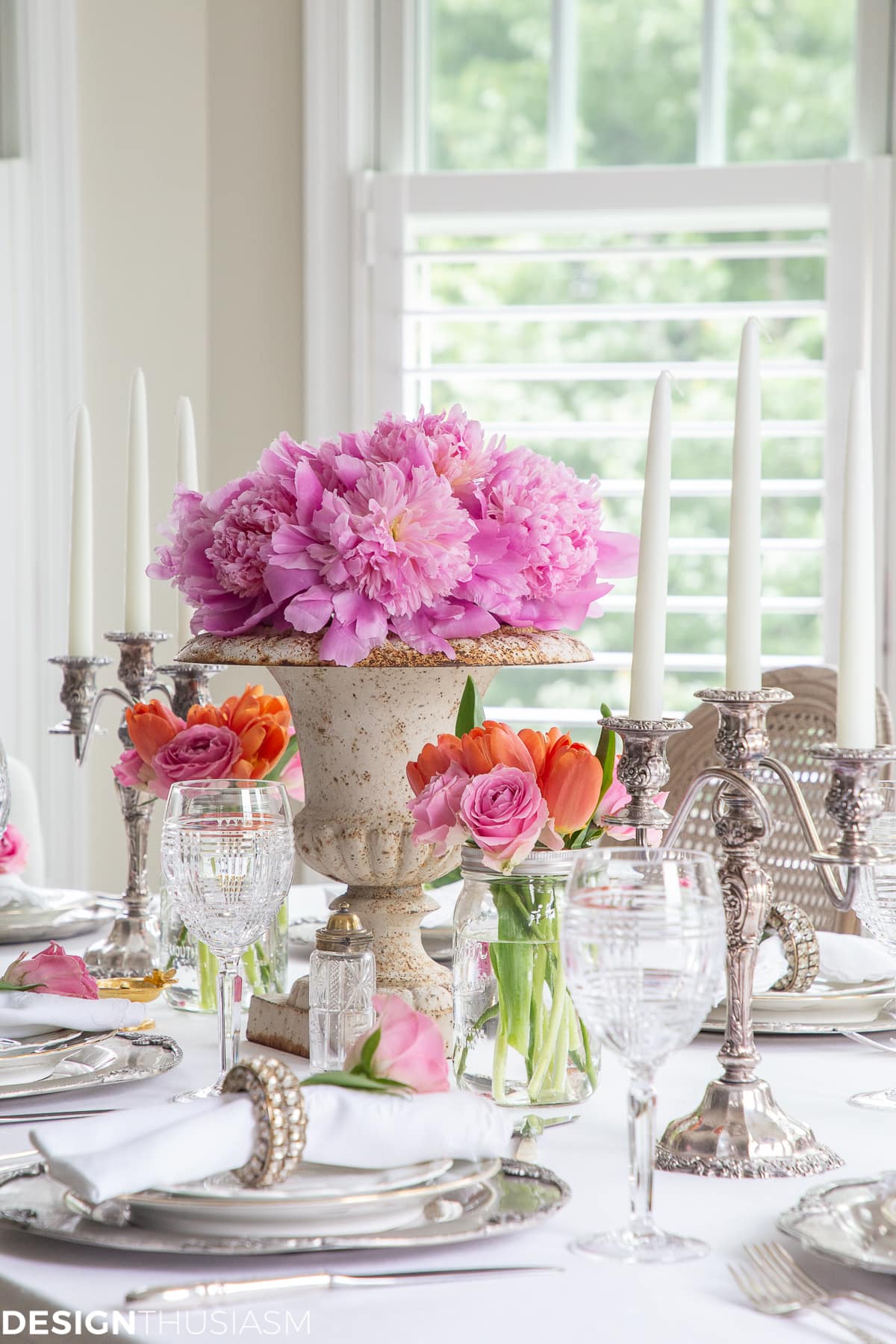 white dining table setting with summer flowers